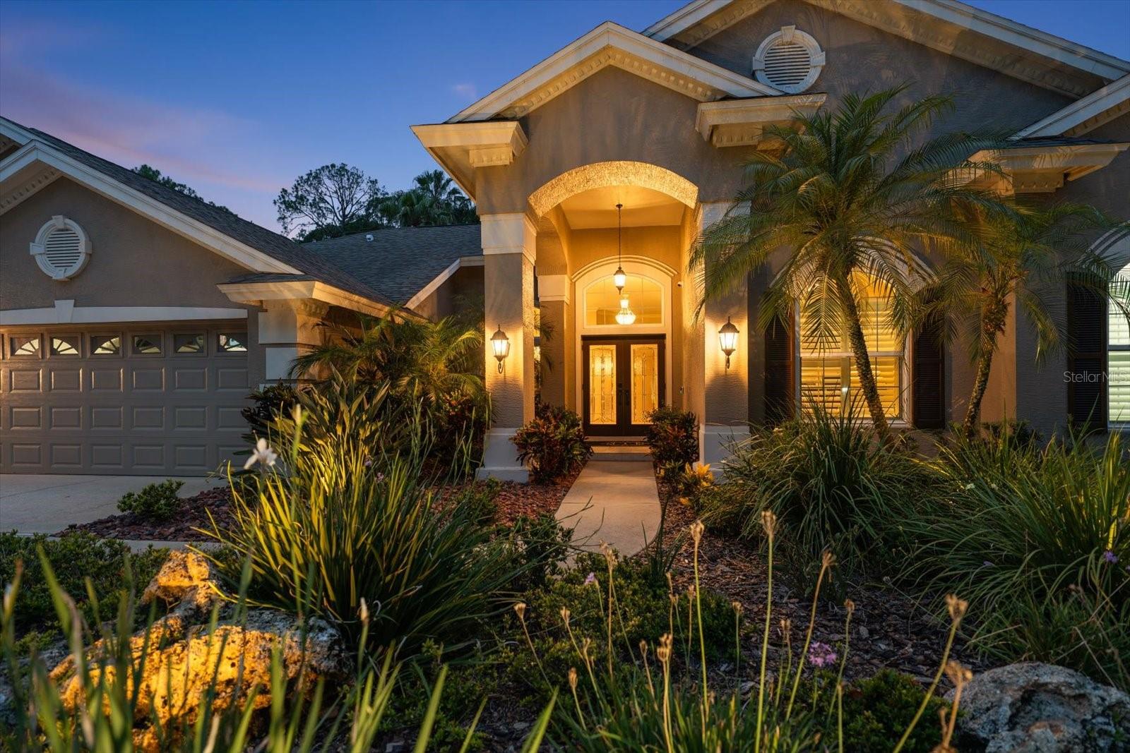 Exceptional Lansbrook Luxury Retreat

Welcome to this beautifully updated one owner Arthur Rutenburg home in the highly sought-after Lansbrook community, where luxury, comfort, and resort-style living come together to create the ultimate Florida lifestyle.

From the moment you enter, you'll appreciate the home's elegant design, highlighted by a chic dining room chandelier and stunning views of the pool through newly installed hurricane-impact windows. The spacious family room features a cozy wood-burning fireplace, while a large private office provides the perfect space for working from home or managing daily activities.

The chef-inspired kitchen is thoughtfully designed with abundant custom cabinetry, granite countertops, and premium appliances, including a double wall oven, cooktop, microwave, dishwasher, and refrigerator. Adjacent to the kitchen, the laundry room includes a washer, dryer, and additional cabinetry, offering ample storage and functionality.

The luxurious primary suite serves as a private retreat, featuring dual closets and a beautifully renovated spa-like bathroom complete with a freestanding soaking tub and an expansive walk-in shower. Three additional bedrooms are located on the opposite side of the home, providing privacy and comfort for family members and guests.

Step through the hurricane-rated sliding glass doors and discover your own private outdoor oasis. The screened lanai showcases an oversized heated saltwater pool with a sun shelf, creating the perfect setting for relaxation and entertaining. Enjoy your morning coffee beneath the covered veranda as the outdoor gas fireplace adds warmth on cooler mornings.

The outdoor living experience continues with a built-in kitchen and grill, ideal for hosting family and friends. Lush tropical landscaping surrounds the pool area, creating a serene and private retreat. As the sun sets, gather beneath the charming tiki hut and enjoy your favorite beverage while taking in the peaceful surroundings.

Beyond the home, Lansbrook offers an exceptional lifestyle with access to a private park featuring playgrounds, basketball courts, a gazebo and miles of walking trails.  Owners also enjoy private access to Lake Tarpon for boating and fishing, while being just minutes from world famous Clearwater Beach, Honeymoon Island State Park, the Suncoast YMCA, Tampa International Airport and Professional Football, Baseball and Hockey.

Combining elegant interiors, exceptional outdoor living, and an unmatched location, this residence presents a rare opportunity to experience one of the Tampa Bay area's premier communities.
