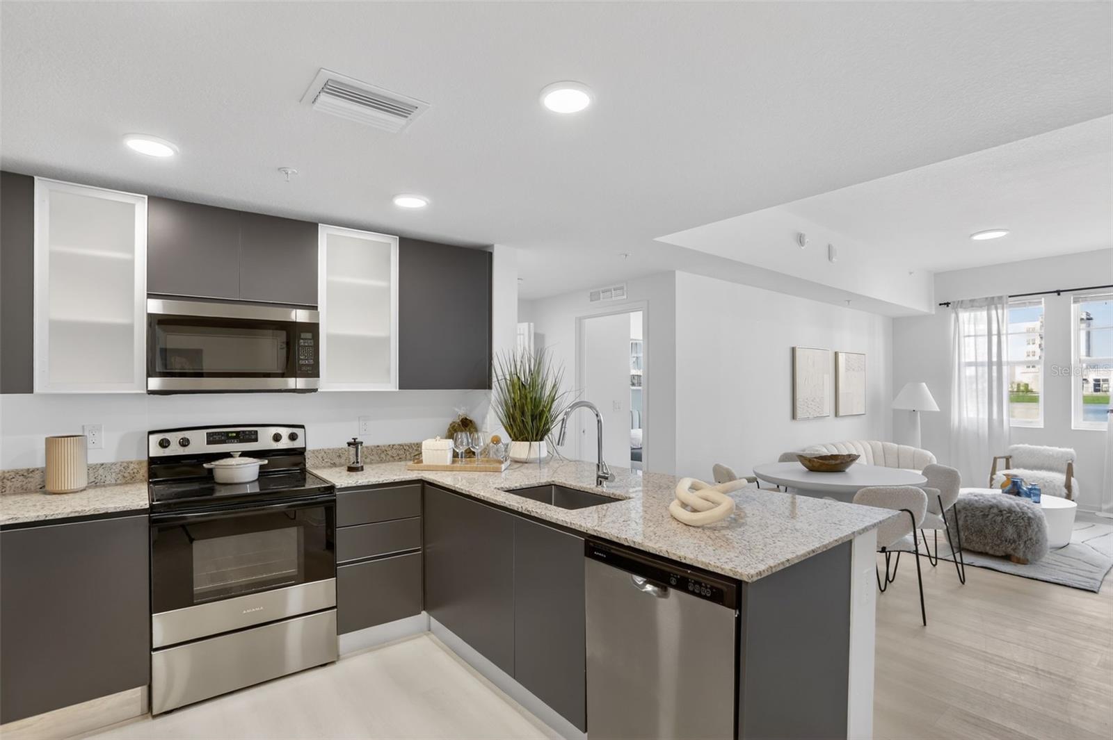 WAIVED APPLICATION FEES! (conditions apply, please call to confirm details) Brand new 2-bedroom, 2-bath condominium with a den in Central Orlando. Designed with modern lifestyles in mind, this spacious residence features an open layout, granite countertops, stainless steel appliances, abundant natural light, and flexible living spaces. Enjoy access to resort-inspired amenities including a lakefront pool, fitness center, walking trails, playground, dog park. Located just minutes from Millenia Mall, dining, entertainment, Downtown Orlando, Universal Studios, Epic, I-4 and Conway and John Young pkwy, convenience is always within reach. A rare opportunity to live in a new construction home in one of Orlando's fastest-growing and most connected neighborhoods. *Photos are of model home, the home is vacant and unfurnished, some photos have been virtually staged.*