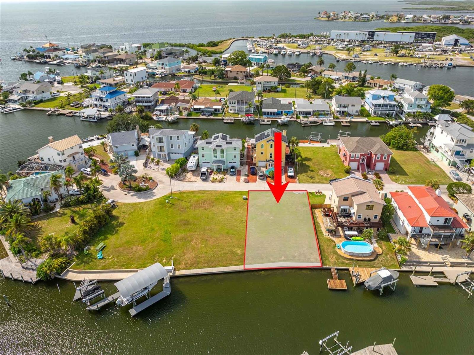 Build your custom waterfront retreat on this exceptional canal-front homesite in the sought-after Hudson Beach Estates community. Offering direct Gulf access with no HOA, this cleared, high-and-level lot is ready for your vision. Situated on a wide, deep-water canal with no tide restrictions, the property features approximately 60 feet of reinforced concrete seawall with a professionally completed seawall reinforcement project and a new 4-foot solid-poured concrete cap completed in 2021, providing both long-term stability and a generous waterfront walkway.

Underground utilities are already in place, making this an ideal opportunity for your future coastal home. Enjoy beautiful water views, Gulf breezes, and quick access to the open Gulf of Mexico for boating, fishing, kayaking, paddleboarding, or simply taking in unforgettable Florida sunsets. Hudson is also recognized as the last deep-water port along Florida's Gulf Coast before the Big Bend region, making it an appealing location for boating enthusiasts.

The adjacent Lot 7 is also available for purchase, creating the opportunity to own nearly one-third of an acre of waterfront property with expanded building options and additional privacy.

Located just minutes from waterfront restaurants, marinas, public boat ramps, charter fishing, and local entertainment, you'll enjoy the relaxed coastal lifestyle Hudson Beach is known for while remaining conveniently close to shopping, medical facilities, and major roadways. Whether you're planning a full-time residence, vacation getaway, or investment property, this build-ready waterfront lot offers the perfect foundation for life on Florida's Gulf Coast.