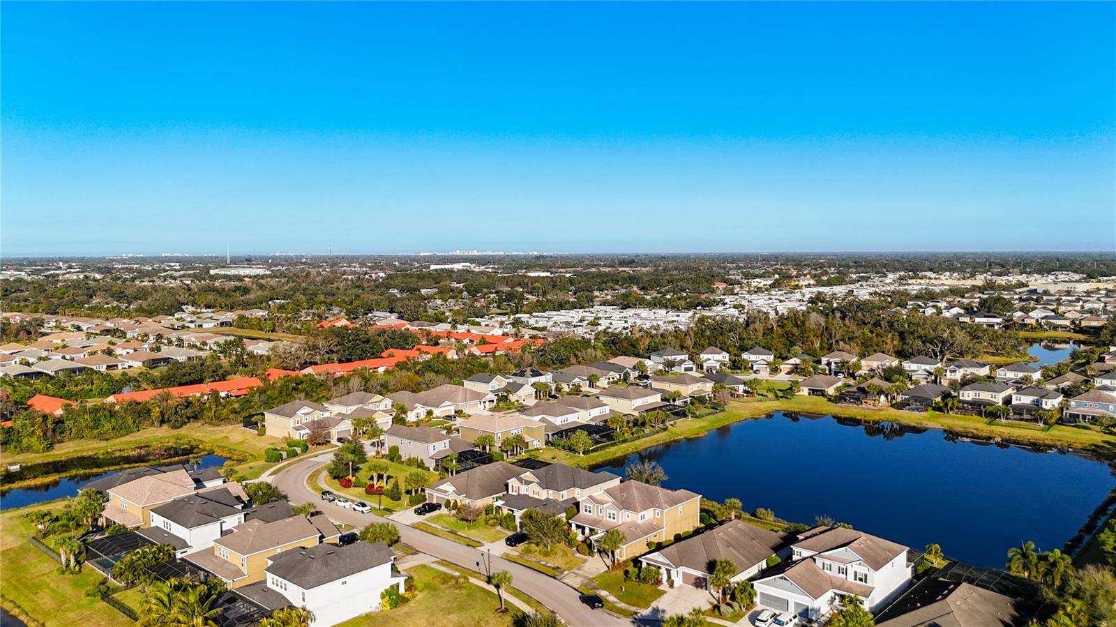 Welcome to the premier community of Arbor Lakes at Palmer Ranch, a life-style community. Just minutes to Siesta Key Beach, downtown Sarasota, top rated schools, shopping, restaurants, public parks, Legacy Bike Trail, and easy access to I-75. One owner home of 4761 sqft, 5 bedroom, 5 bath home! This lovely two story home has it all!  Meticulously maintained, designer features and finishes throughout. Your tranquil homesite has panoramic lake views both front and back. Don't forget to take advantage of the resort style amenity center featuring a resort style pool, hot tub, splash park, beach volleyball, full size basketball court, fire pit and playground! For those with pets, the community also offers a large fenced in dog park. Centrally located to everything in the area and only 6 miles to Siesta Key! Low HOA and no CDD fees .Don't miss the chance to own this exceptional home in one of Sarasota's most coveted communities. Recently, this community was assigned to newly built Skype Ranch School zone. Schedule a showing today and see for yourself how this home can meet your family's needs and more.cently