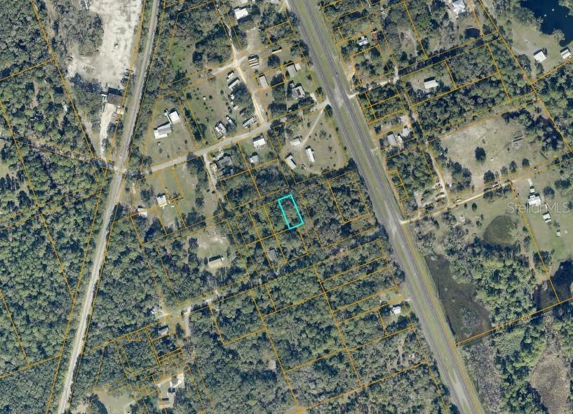 Vacant residential lot zoned for manufactured home in Oak Hill close to fishing, boating, and Burns Elementary. Located in the lowest flood risk Zone X.  The lot is wooded natural Florida and currently landlocked. A legal easement will need to be obtained for access. Zoning does not allow parking of RV's or trailers on the property without being improved with a residence first. Parcel number 953704180010.