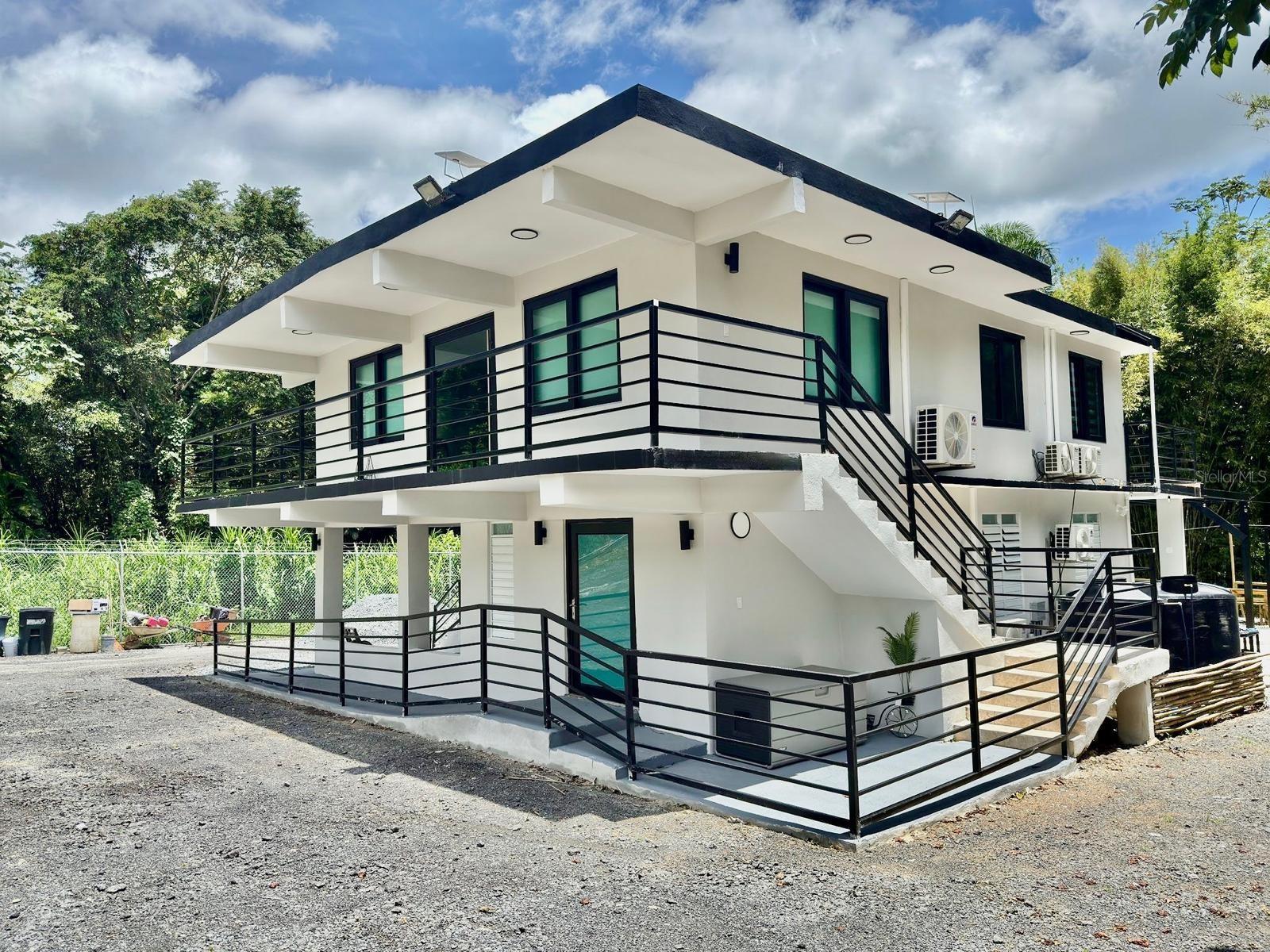 HACIENDA SELAH – RIO GRANDE, PUERTO RICO

Welcome to Hacienda Selah, a stunning fully furnished and turnkey property offering the perfect blend of luxury, privacy, and income-producing potential.

This exceptional estate features two completely independent spaces, each offering 3 bedrooms and 2 full bathrooms, for a total of 6 bedrooms, 4 full bathrooms, and 1 half bathroom, comfortably accommodating approximately 17 guests.

Property highlights include:

• Resort-style heated swimming pool with spa-style jets
• Outdoor BBQ and food preparation area with sink
• Private mini-golf course
• Basketball court
• Spacious outdoor entertainment areas
• Beautiful creek running behind the property
• Surrounded by nature, privacy, and tropical landscaping
• Electric gate and security camera system
• Air conditioning throughout both levels
• PVC kitchen cabinetry
• Travertine flooring and high-end finishes
• Sold fully furnished and equipped – truly turnkey

Located in FEMA Flood Zone X (Area of Minimal Flood Hazard), outside of the Special Flood Hazard Area (SFHA), providing added peace of mind for homeowners and investors alike.

Ideally situated in Rio Grande, Puerto Rico, this unique property offers convenient access to beaches, El Yunque National Forest, golf courses, marinas, and the area's top attractions.

Whether you're looking for a luxurious private retreat, multi-generational living, or an income-producing investment property ready for short-term rentals, Hacienda Selah presents an exceptional opportunity.

All information provided, including but not limited to square footage, lot size, room dimensions, and property features, is deemed reliable but not guaranteed. Measurements are approximate. Buyers and their agents are responsible for independently verifying all information and conducting their own due diligence.
