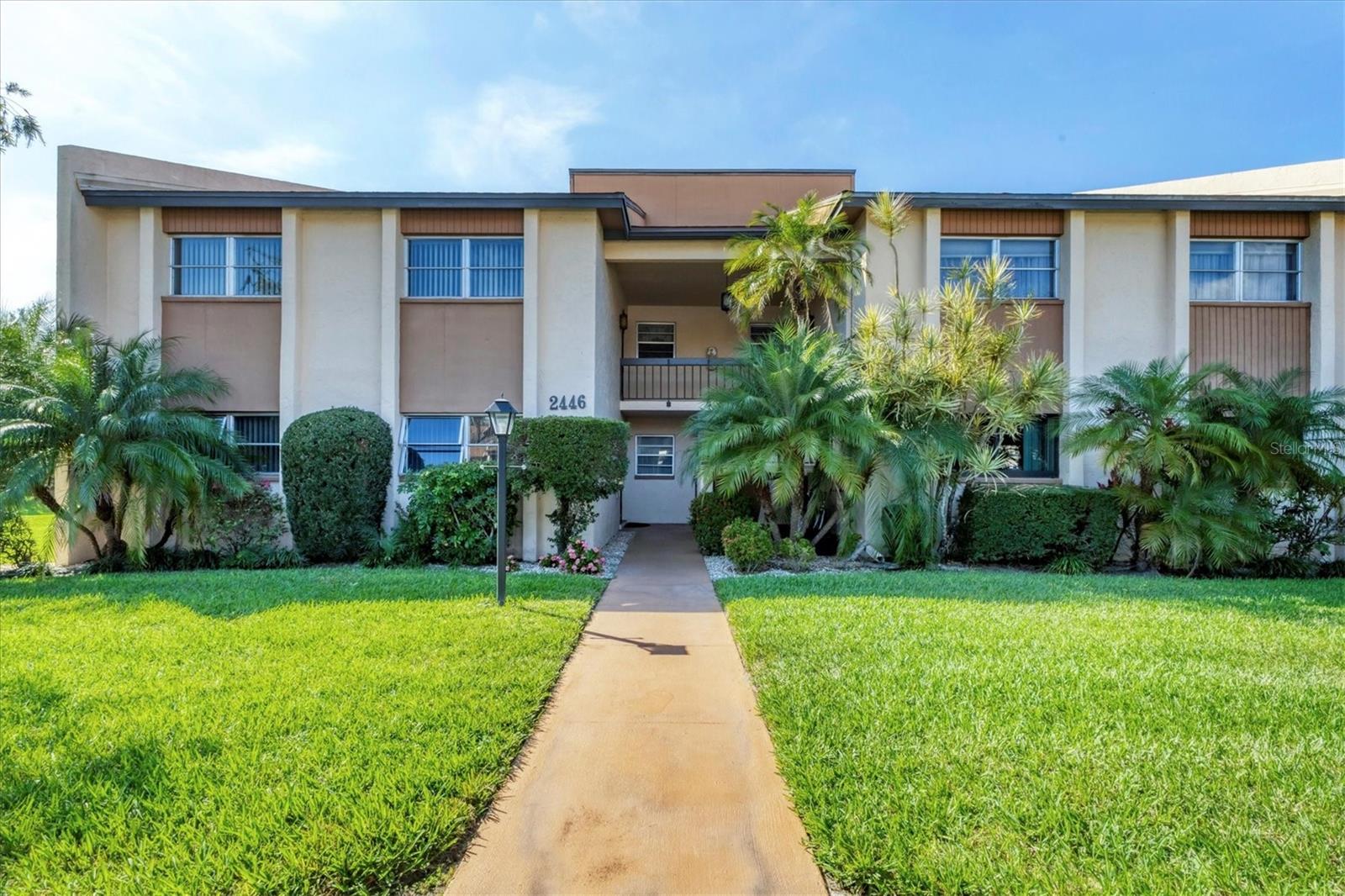 NEW PRICE & MOVE IN READY!  Bring your offer on this spacious 2bed/2 bath with volume ceilings and great natural light!  Enjoy extended square footage for larger living space!  It is just steps from the pool & clubhouse, covered parking out front, and fully furnished! Relish the fabulous wall of windows in your light and bright family room with HIGH CEILINGS and an OPEN FLOOR PLAN.  The spacious bedrooms, ample storage for all your toys and the fabulous amenities are hallmarks of the ideal Florida lifestyle in this well maintained, FULLY FURNISHED condo!  The large living and dining room create a relaxing Great Room. This light and bright condo in a quiet, amenity rich community, is ideally located just around the corner from the Legacy Trail and lots of shops & eateries, and just minutes from the sand in your toes on SIESTA KEY! The ease of covered, assigned parking just steps from your door, makes your daily beach trips effortless!  This pet friendly, 55+ community, includes fantastic amenities (like the year round HEATED POOL, exercise room, library, billiards and card tables, plus a grill area for outdoor gatherings) and is close to everything, in a quiet enclave of its own!  Escape here to Paradise!