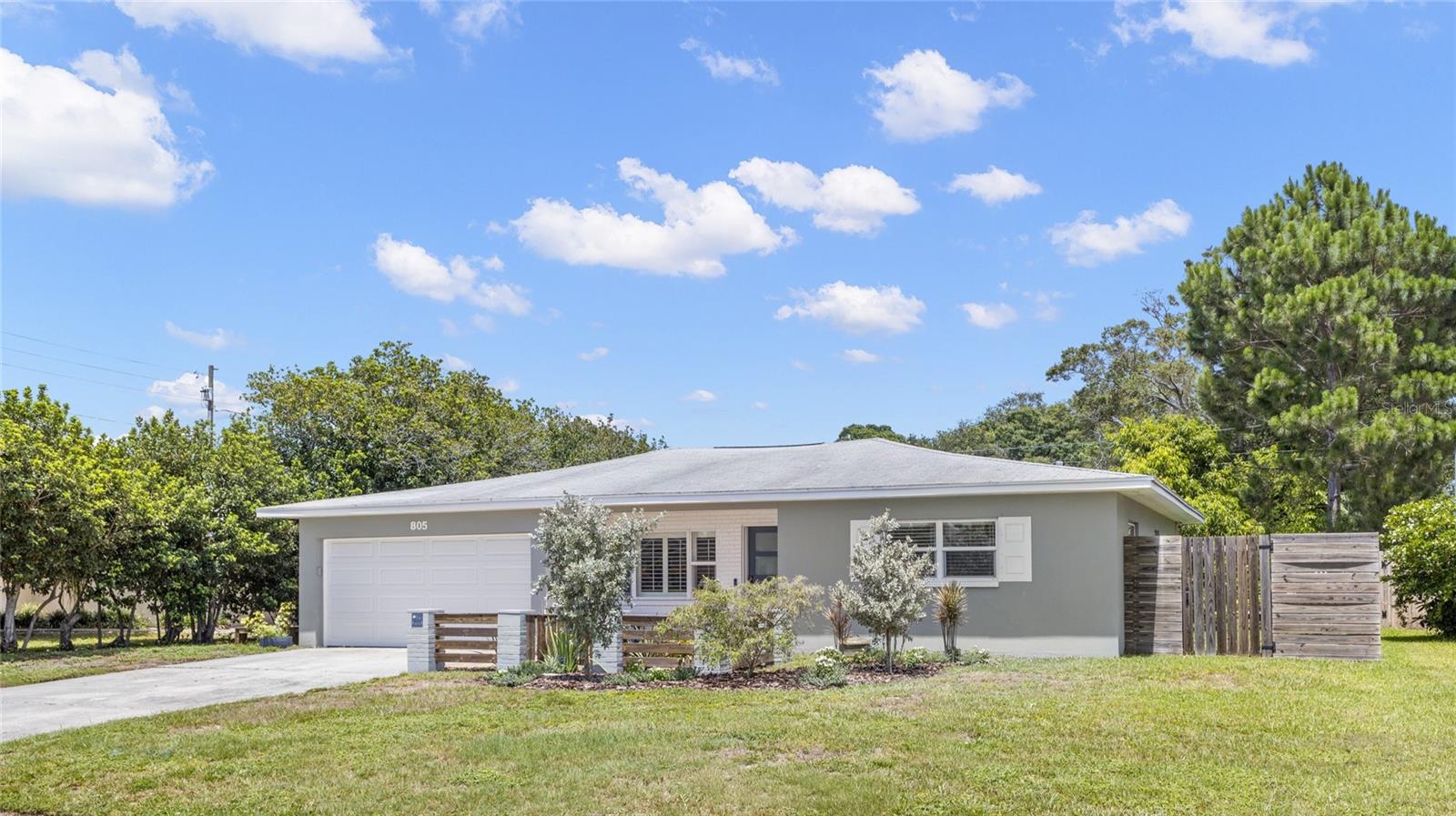 Nearly one-third of an acre. Peaceful pond views. Non-flood zone. No HOA. Welcome to a home that offers the perfect blend of privacy, outdoor space, and convenience in the heart of Clearwater. This solid block 2-bedroom, 1-bath home overlooks a tranquil pond while placing you just minutes from Clearwater Beach, Downtown Clearwater, Safety Harbor, Dunedin, shopping, dining, parks, and major commuter routes. A welcoming front courtyard accented by custom decorative fencing, fresh landscaping, and new exterior paint creates an inviting first impression and the perfect spot to enjoy your morning coffee or unwind at the end of the day. An oversized driveway and attached two-car garage provide plenty of parking, storage, and workspace. Inside, natural light fills the open floor plan, showcasing luxury vinyl plank flooring, crown molding, plantation shutters, updated ceiling fans, new light fixtures, and fresh interior paint throughout. The spacious living and dining areas flow effortlessly together, creating a comfortable layout for everyday living and entertaining. The beautifully remodeled kitchen serves as the heart of the home with rich wood cabinetry, granite countertops, a center island, abundant storage, generous prep space, and brand-new black stainless steel appliances (2026). One of the home's standout features is the heated and cooled Florida room overlooking the pond. Wrapped in windows, it's the perfect space for a family room, home office, reading nook, hobby room, or simply relaxing while enjoying the peaceful water views. Both bedrooms are generously sized with ample closet space. The full bath offers the convenience of a separate soaking tub and walk-in shower, while the spacious inside utility room provides additional storage and direct access to the backyard. Step outside to an expansive backyard set on an impressive .30-acre homesite. Whether you're entertaining, gardening, letting pets roam, or simply enjoying the tranquil pond framed by mature trees, this outdoor space offers a sense of peace that's increasingly hard to find in Clearwater. Recent improvements include a 2020 HVAC system, 2020 water heater, new front and back door along with the hurricane impact garage door, new flooring, new fencing, fresh landscaping, updated lighting, ceiling fans, a new bath faucet, new outdoor spigots, fresh interior and exterior paint, hurricane shutters, and new black stainless steel appliances (2026). With no HOA, you'll enjoy the freedom to personalize and enjoy your property without monthly association fees or added restrictions. Conveniently located near Clearwater Beach, Coachman Park, The Sound, Eagle Lake Park, Downtown Clearwater, Safety Harbor, Dunedin, top-rated medical facilities, shopping, restaurants, Tampa International Airport, St. Pete-Clearwater International Airport, Gulf-to-Bay Boulevard, and US-19. 
Homes offering pond views, a non-flood-zone location, nearly one-third of an acre, and this level of updating are rarely available. Come experience the setting, the space, and the lifestyle that make 805 Wellington Drive truly feel like home.