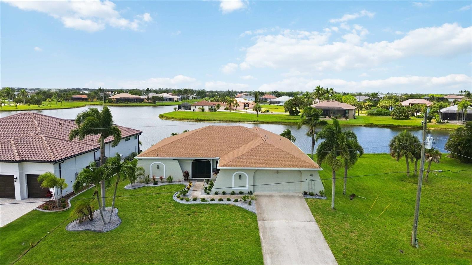 Welcome to waterfront living in the sought-after Burnt Store Lakes community! This beautifully updated 3-bedroom, 2-bath home offers over 2,100 square feet of living space and stunning lake views from multiple areas of the home.
Step inside to discover a spacious split-bedroom floor plan featuring updated flooring, a remodeled kitchen, updated bathrooms, cathedral ceilings, and abundant natural light throughout. The expansive enclosed lanai provides the perfect space for year-round entertaining, relaxing, or simply enjoying peaceful water views.
Recent improvements include a newer roof, air conditioning system, water heater, and flooring, providing peace of mind for years to come. The oversized 2.5 car garage offers ample room for vehicles, storage, hobbies, or a workshop.
Situated on a waterfront lot in Burnt Store Lakes, residents enjoy access to community amenities including a kayak and canoe launch, park, playground, picnic pavilion, and scenic sidewalks. Conveniently located near Burnt Store Marina, golf, dining, boating, fishing, shopping, and everything Punta Gorda and Southwest Florida have to offer.
Whether you're searching for a full-time residence, seasonal retreat, or investment opportunity, this waterfront gem offers the perfect blend of comfort, convenience, and Florida lifestyle living.