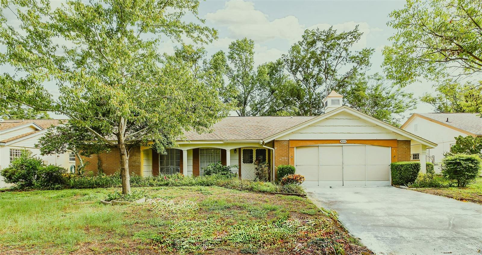 Lovely home just waiting for your personal touches.  AC 2026, electrical panel 2018, updated plumbing 2019 and roof 2011.  Newer washer and dryer.  Split bedroom plan, open and bright kitchen with pass thru to screened lanai.  Ensuite bath in Primary bedroom with walk-in closet, family room by the kitchen and separate living room with dining.  All the big items are done and the home just needs updating.  Community has a pool and golf course.  Close to shopping and medical facilities and the beach.  Priced to sell, so see it today!