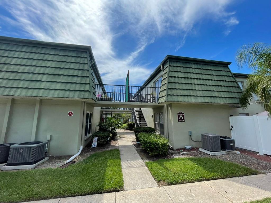 Welcome to your perfect Florida retreat! This beautifully updated 2-bedroom, 2-bathroom first-floor condo with smart features in the highly desirable Fountain Square community is a rare find! Renovated from top to bottom, this move-in-ready gem offers a seamless blend of modern comfort, functionality, and beachside charm.

Step inside to discover fresh paint, luxury vinyl plank flooring throughout, new light fixtures, and stylish bathroom vanities that bring a sleek, contemporary feel to every space. The kitchen is a showstopper and has been fully transformed, featuring stunning countertops with backsplash, shaker-style cabinetry with undercabinet lights and stainless steel appliances — perfect for cooking, entertaining, and enjoying meals in style.

Both bathrooms feature stylish tiles and mosaic accents. Great mirrored closet adds a clean, modern touch. This home has smart features you will love smart thermostat, water temperature indicating kitchen faucet, multicolor undercabinet lights and programmable front door lock. New roof already paid for by current owner will give peace of mind and long-term value. You'll also appreciate the abundant closet space and remote controlled fans in every room.

The home enjoys plenty of natural light, and even includes a private balcony, adding to the inviting indoor-outdoor living experience. Assigned parking steps away from unit, guest spaces, and a pet-friendly policy (two small pets allowed) add extra appeal. Whether you're seeking a full-time residence, seasonal escape, or investment property, this unit checks every box.

Located just minutes from Clearwater's award-winning beaches, Honeymoon Island, Caladesi Island, and Downtown Dunedin, you’ll love the vibrant coastal lifestyle. Enjoy nearby golf courses, dog-friendly walking areas, and local shopping, including a Walmart directly across the street for ultimate convenience.

Fountain Square offers a wide range of amenities, including a sparkling pool, fitness center, clubhouse, laundry facilities, and well-maintained common areas. Low monthly HOA fees cover cable, water, trash, roof, and exterior maintenance—providing true stress-free living.

This beautifully upgraded and sun-filled condo has everything you need and more.