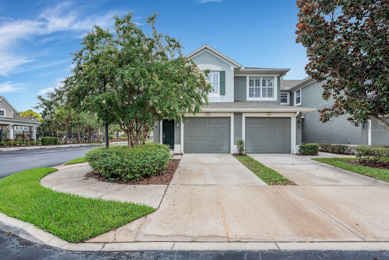 Set on a corner lot directly across from the Villa Serena clubhouse, pool, and greenspace, this updated, move-in-ready home offers two bedrooms, two baths, a flex space that could be a third bedroom, and low-maintenance living in a gated Riverview community. The front door opens to a private staircase, with the attached one-car garage located on the first floor and the full living space arranged upstairs.
High ceilings, fresh neutral finishes, and an open floor plan create a bright, comfortable interior. Updated wood-look LVP flooring runs throughout the main living and dining areas, while the kitchen features granite countertops, solid wood cabinetry, stainless steel appliances, generous workspace, and a casual dining area. Both bedrooms along with a flex room are located on the main living level, including a spacious primary suite with a walk-in closet.
A large, fully screened lanai extends the living space outdoors, offering plenty of room to relax or dine while overlooking the community surroundings. Villa Serena residents enjoy access to a clubhouse, swimming pool, fitness center, and landscaped common areas, with shopping, dining, I-75, and the Selmon Expressway nearby. Don’t miss your chance to see this home in person!