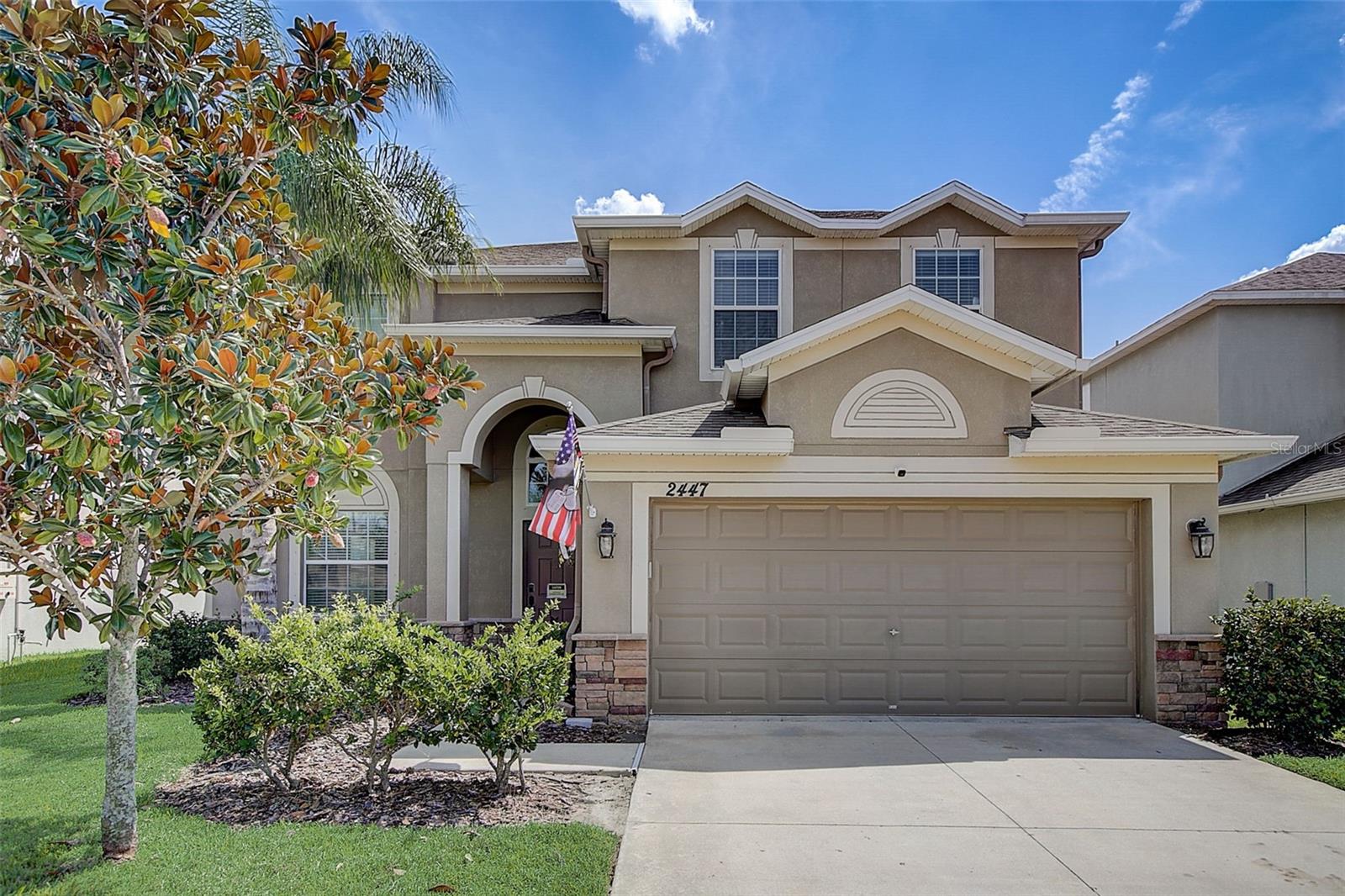 This GORGEOUS Solar powered Pool home is 3010 sq ft. Upon approach your immediately greeted by luscious mature landscaping, new sprinkler system detailed stonework on the exterior. This gem presents with 5 generously sized bedrooms, 3 full bathrooms w/granite countertops, media room, formal living & formal dining room as well as family room. The Kitchen offers solid wood upgraded 42" staggered cabinets w/upper crown molding, granite countertops, stainless steel appliances, an island, breakfast bar, homework station, dinette area, two pantries and breakfast nook which opens to a large family room! The formal dining and living rooms are adjacent in a large area that has endless possibilities. Walls throughout renders arches and rounded wall corners for a gorgeous detail.  Both HVAC air handlers have been updated and feature Bioshield UV Air purifier for the whole house. A secluded secondary bedroom offers added privacy on the first level with a full bathroom.  The backyard features a saltwater pool and offers a beautiful lake view.  You can enjoy a serene and picturesque setting right from your own backyard after a long day. It's a perfect combination for those who love swimming and being surrounded by nature. On the second level are 3 bedrooms, a media room, and the primary suite. The primary master suite and bathroom features granite countertops, walk-in closets, garden soaking tub, walk-in shower, and dual sinks. The laundry room is also located on the second floor.  This gem is spacious and an eco-friendly option. The solar power helps reduce energy costs and the pool adds an extra element of luxury and relaxation. The media room provides a space for entertainment and movie nights. Overall, it’s a great choice for those looking for a larger home with all the modern features.  Hawk's Point is a gated community with many amenities including a resort style pool, playground, gym, dog park, Rec center with games and can use for private parties! Walking distance to high school, elementary and community college. The middle school is a short 5-minute drive. Conveniently located to I-75, shopping, and restaurants and more!