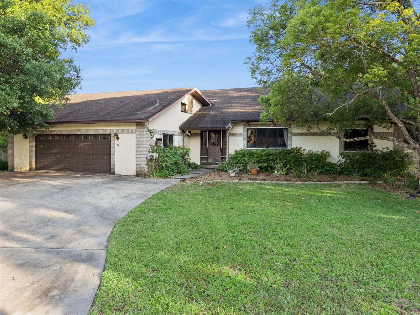 **This house comes with a REDUCED RATE through the seller's preferred lender. This is a lender-paid rate buydown that reduces the buyer's interest rate and monthly payment.**

Welcome to 3443 Parkland Street in Titusville, a spacious two-story home offering 5 bedrooms, 3 bathrooms, a loft, and attic space. With its generous square footage and flexible layout, this property presents a strong opportunity for buyers looking to renovate and add value.

Inside, the floorplan offers a functional layout with multiple living areas that can be reimagined to suit a variety of needs. The dining area features a fireplace that adds character and could become a standout feature with the right updates. The loft provides additional space for a second living area, office, or recreation room, while the attic offers extra storage. With five bedrooms and three full baths, there is plenty of room to accommodate a larger household or flexible living arrangements.

The home is in need of repairs and updates throughout, making it ideal for those ready to take on a project. With the right improvements, the space has the potential to be transformed into a comfortable and inviting home.

Outside, the screened in-ground pool and surrounding patio and deck offer a solid starting point for creating an enjoyable outdoor space. With some work and vision, this area could be turned into a great spot for relaxing or entertaining.

Overall, the property offers a combination of size, layout, and potential that is well suited for investors or buyers looking to customize a home to their preferences.

Located in Titusville, the home sits in an established neighborhood with convenient access to shopping, dining, parks, schools, and major roadways, adding to its long-term appeal.
