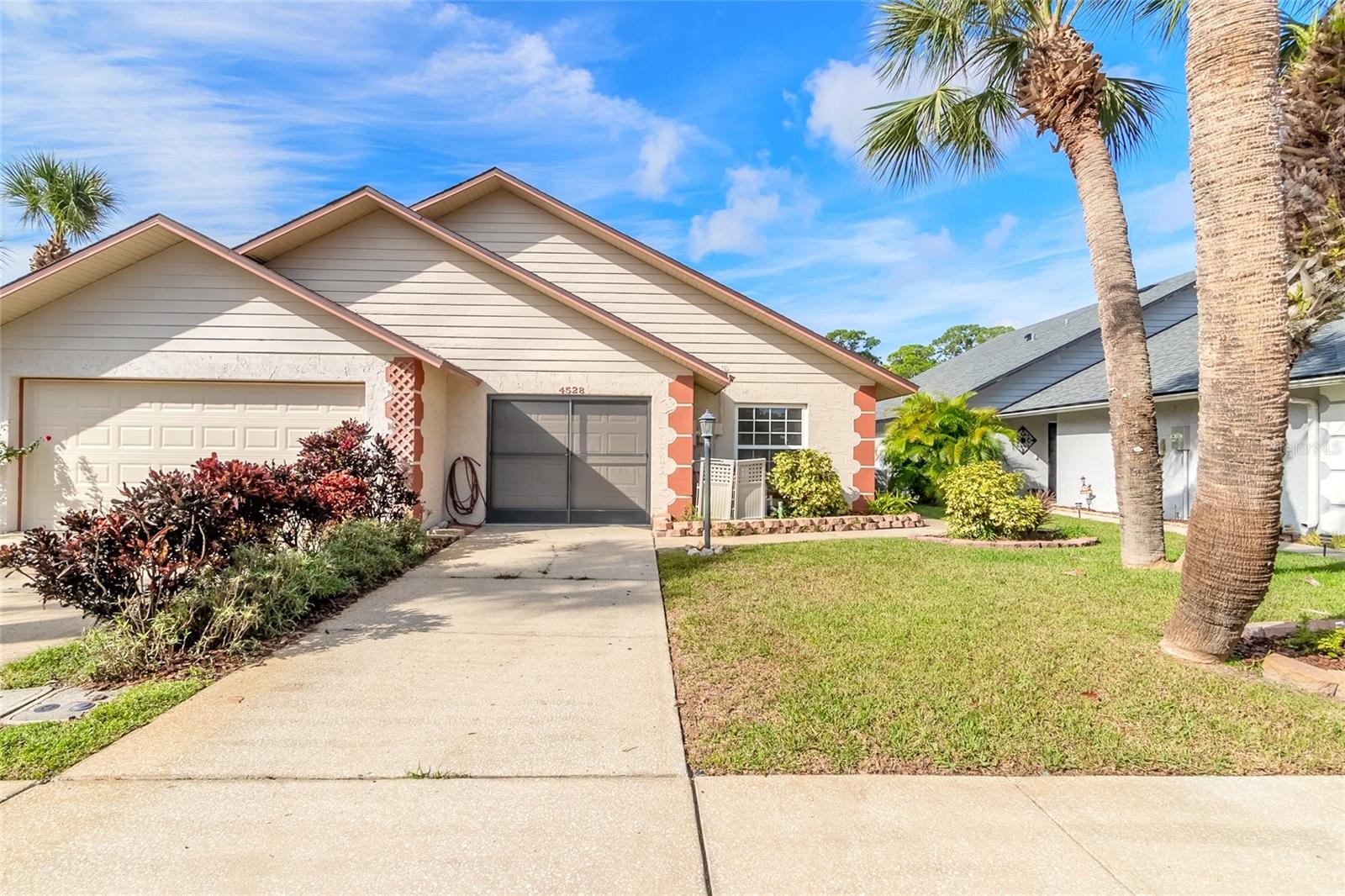 This stunning property is located in the desirable Shallowbrook neighborhood in Dunlawton Hills, a community with its own swimming pool for residents. It is perfect for a first-time buyer, student, or empty nester. Enjoy the charming lake/pond view from the Florida room. The home has been recently renovated with a new roof, AC, and hot water heater, so you can move in with peace of mind. The kitchen is beautifully laid out with an island preparation area, and the dining room is spacious and versatile. It can be used as an office or converted into a third bedroom. This home is clean and ready for immediate occupancy. Don't miss this opportunity to own your dream home in Port Orange and you may even pay less than you would pay elsewhere in rent!