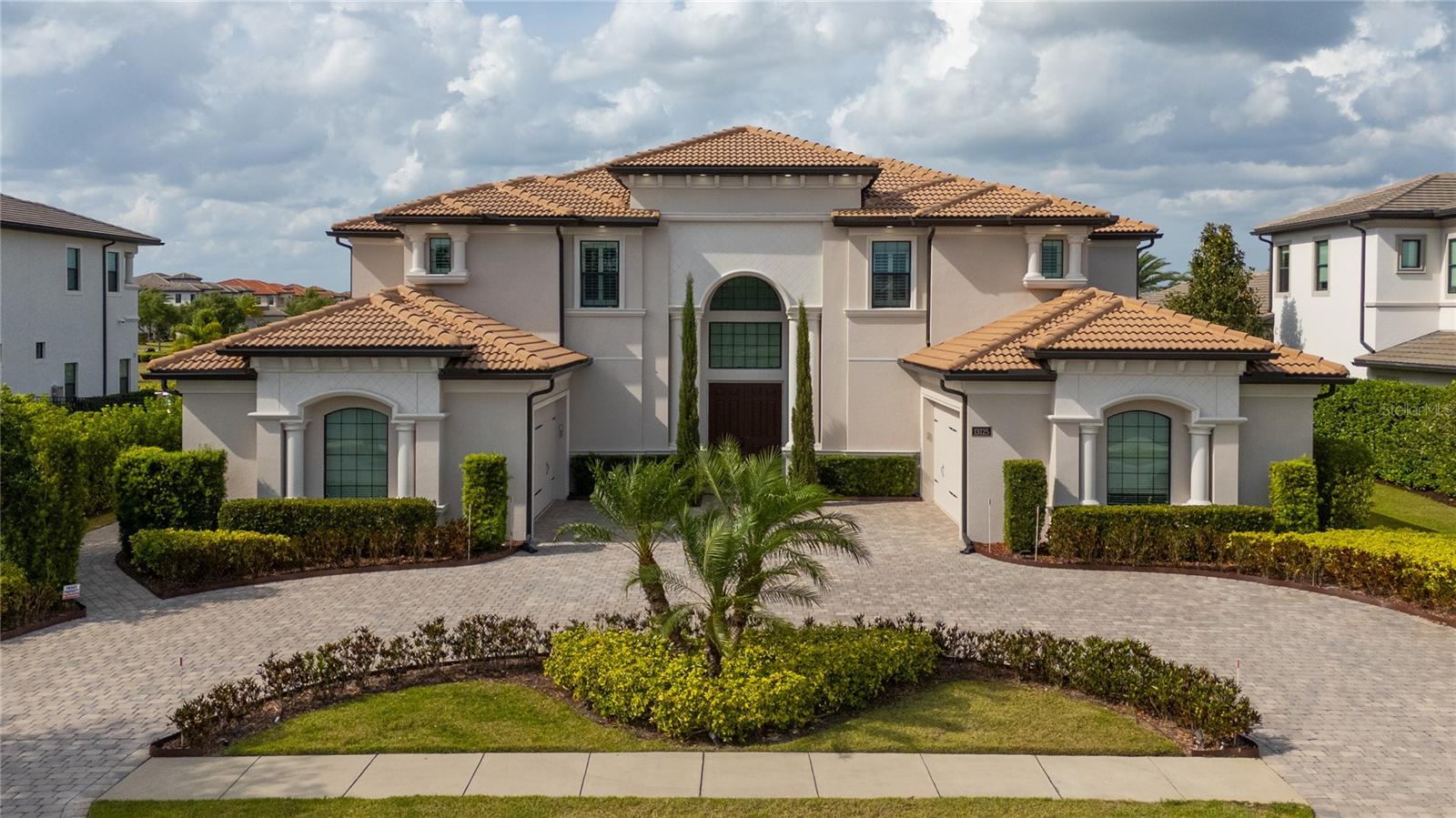 HUGE PRICE IMPROVEMENT – SELLER MOTIVATED Welcome to Your Fully Automated Home in Casabella at Windermere
Introducing a spectacular 7,561 sq. ft. estate home perfectly positioned on a half-acre lot with tranquil pond views at both the front and rear. This 5-bedroom, 5.5-bath masterpiece offers total privacy, elegance, and cutting-edge technology. Fully integrated with Alexa and smart home controls, manage the entire property via iPad or mobile device from anywhere in the world.

As you enter, a grand double staircase and balcony make a striking first impression. The main floor features a luxurious oversized Primary Suite with serene water views, dual walk-in closets, and a spa-inspired bathroom. Upstairs are four generously sized bedrooms, each with its own ensuite bath, plus a large flex space ideal for a second living room or game room.

The chef’s kitchen is equipped with top-of-the-line Jenn-Air appliances, extensive cabinetry, and gorgeous countertops. Entertain effortlessly in the expansive open-concept living area with two oversized wine coolers (holding 320 bottles), wet bar, and sleek ceramic porcelain flooring. Upstairs and throughout the staircases, rich hardwood floors bring warmth and charm.
Step outside into a fully enclosed and climate-controlled summer kitchen—complete with BBQ grill, pizza oven, refrigerators, and hurricane-rated windows/doors—creating the perfect year-round entertainment space. The backyard is an oasis with a stunning 850 sq. ft. pool and jacuzzi, framed by lush landscaping.

This home has been meticulously maintained and all improvements were permitted and inspected—no unpermitted additions.

Located in the award-winning Casabella at Windermere, close to shopping, hospitals, top-rated schools, and just minutes from Disney parks. Enjoy luxury, technology, privacy, and convenience in a gated community.