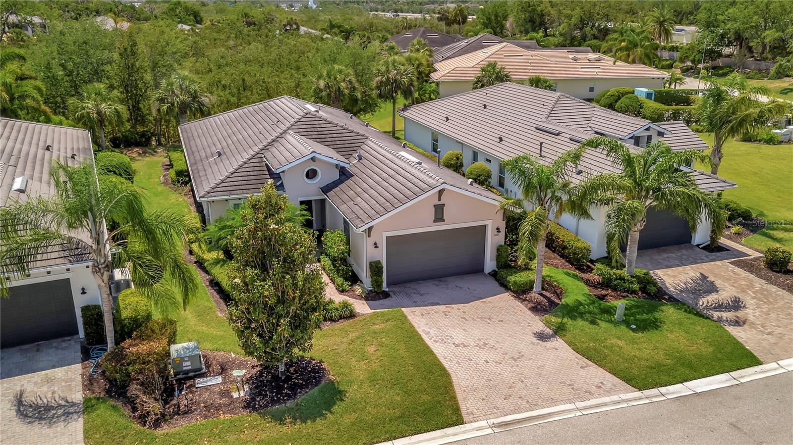 Tour this stunning 3-bedroom plus den, 2-bath, 2-car garage home in Tidewater Preserve—Bradenton’s premier boating community offering direct river access. This beautifully maintained residence comes FURNISHED and features HURRICANE-IMPACT WINDOWS, A WHOLE HOME GENERATOR, tile flooring in the main living areas, and plush carpeting in the bedrooms. Soaring 10+ foot ceilings with elegant tray detailing add a touch of luxury throughout. Just off the entry, a stylish den/home office offers the perfect space to work or relax. The open-concept kitchen is a true highlight, boasting custom wood cabinetry, a stone tile backsplash, granite countertops, and a spacious island featuring a reverse osmosis system and counter bar that opens seamlessly to the great room. Four hurricane-impact sliding glass doors blend indoor and outdoor living—perfect for entertaining. The luxurious primary suite features tray ceilings, two walk-in closets and a spa-inspired en-suite bath. The en-suite bath includes a garden tub, dual vanities, a custom glass-enclosed shower, and a private water closet. For boating enthusiasts, Tidewater Preserve offers a marina with boat lifts, complete with electric and water, providing direct access to the Manatee River. Whether you're cruising to a favorite waterfront restaurant or exploring Anna Maria Island or Egmont Key, the water is your playground. This gated community features 24-hour guard security and a full-time event coordinator. Residents enjoy three resort-style pools, two fitness centers, a clubhouse, tennis courts, riverfront nature trails, a dog park, playground, kayak launch, and a full-service marina. Best of all—there are no CDD fees. An exceptional home in a premier waterfront community—don’t miss your opportunity to make it yours. Excluded from sale are personal items, small bistro table on lanai and master bedroom bedside table lamps.