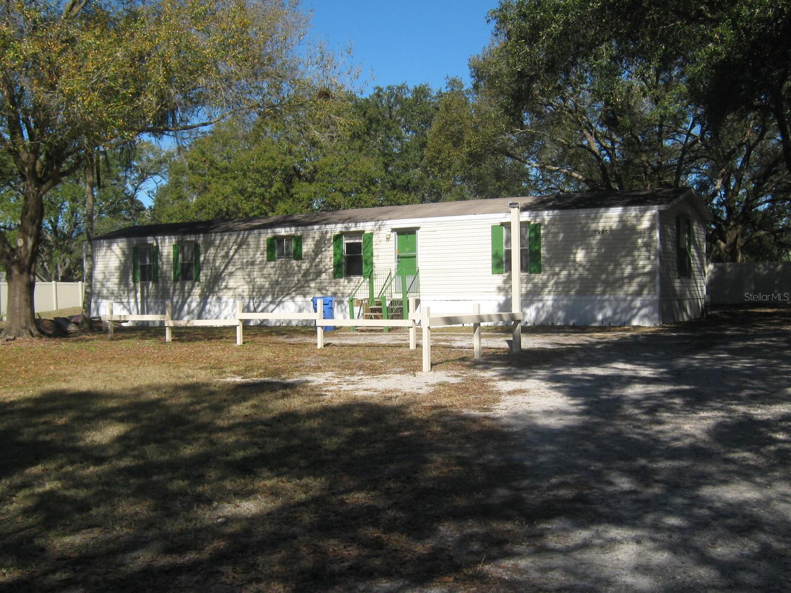 Take a look at this hidden gem.  No HOA!  bring all of your toys or work truck.  Plenty of outdoor space to enjoy family get-togethers. You will enjoy the large coved porch off the back of the home. It feels like you're living in the country, but close to everything.  This home has 3 bedrooms and 2 bathrooms.  Two bedrooms are at one end and the master suite is at the other end, just off the dinning area.  The inside laundry room is equipped with both washer and dryer. Call today to schedule your private viewing.