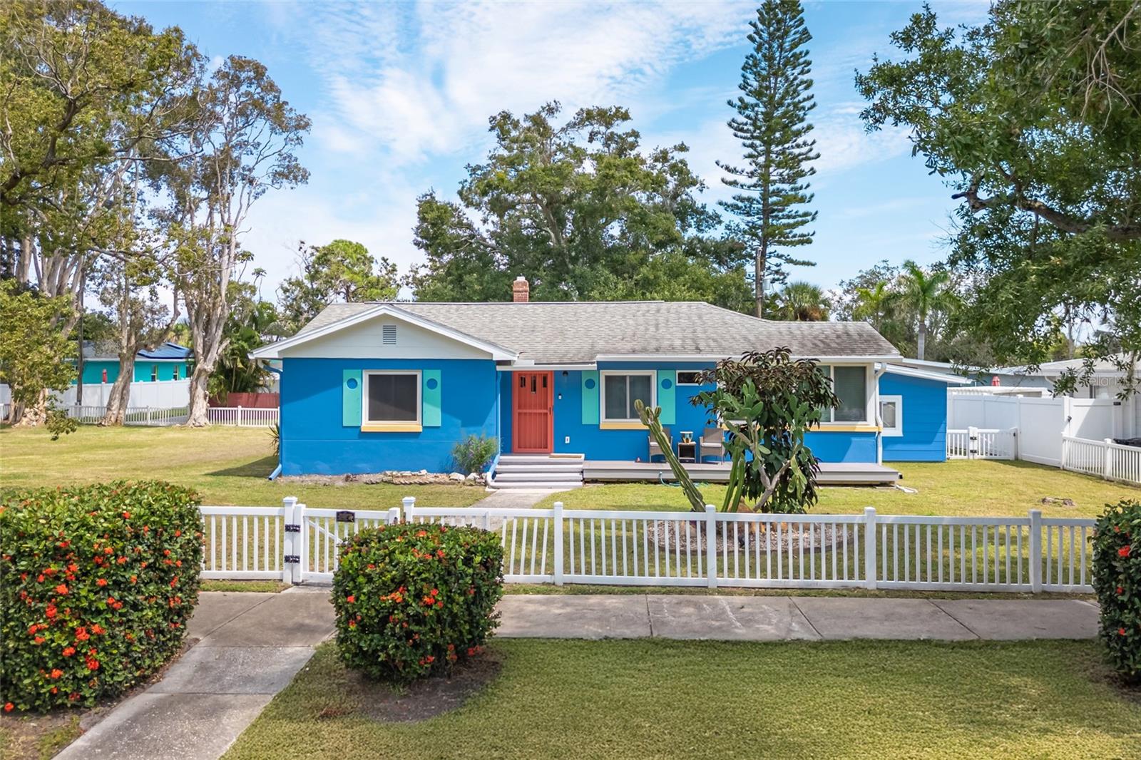This home is steps away from the WATERFRONT and MARINA and Park with Kayak Launch.  Alley for easy access and extra room on oversized lot for RV, Boat, Waverunner and the rest of the toys.  LIKE NEW.  Renovated in 2025. This home has it all:  SOLAR Duke Energy bill approx. $30/mo.  IN-LAW SUITE + Bonus ROOM + 2 BR's + 2 Full Baths + HUGE DECK with electric for Swim/Spa, Spa, and GARAGE with workshop.  Walk to, PARK, SUNSET, TENNIS, and PICKLEBALL. GOLF CART to Downtown Gulfport, Casino, Entertainment, Shops, Restaurants, Tiki Bars, Tennis, and Beach. COMPLETE RENOVATION INCLUDES: Freshly painted inside and out. New FLOORS, New KITCHEN, New BATHROOM, New LARGE CLOSETS with Organizers, FIREPLACE, TREX Front Porch, Gutters, Electric Box and Wiring and so much more...All new! Looks and feels like a NEW HOME. NO HOA; NO EXTRA FEES. RENTALS ALLOWED.  Golf Cart to Downtown or Bike over to the Bike Trail. Vacant, cleared lot next door will be subdivided or available for sale. New Furniture and decor may be purchased separately or purchased turnkey for you or your tenants to take residency immediately.  Beatifully and professionally renovated.  LOCATION LOCATION, LOCATIONL