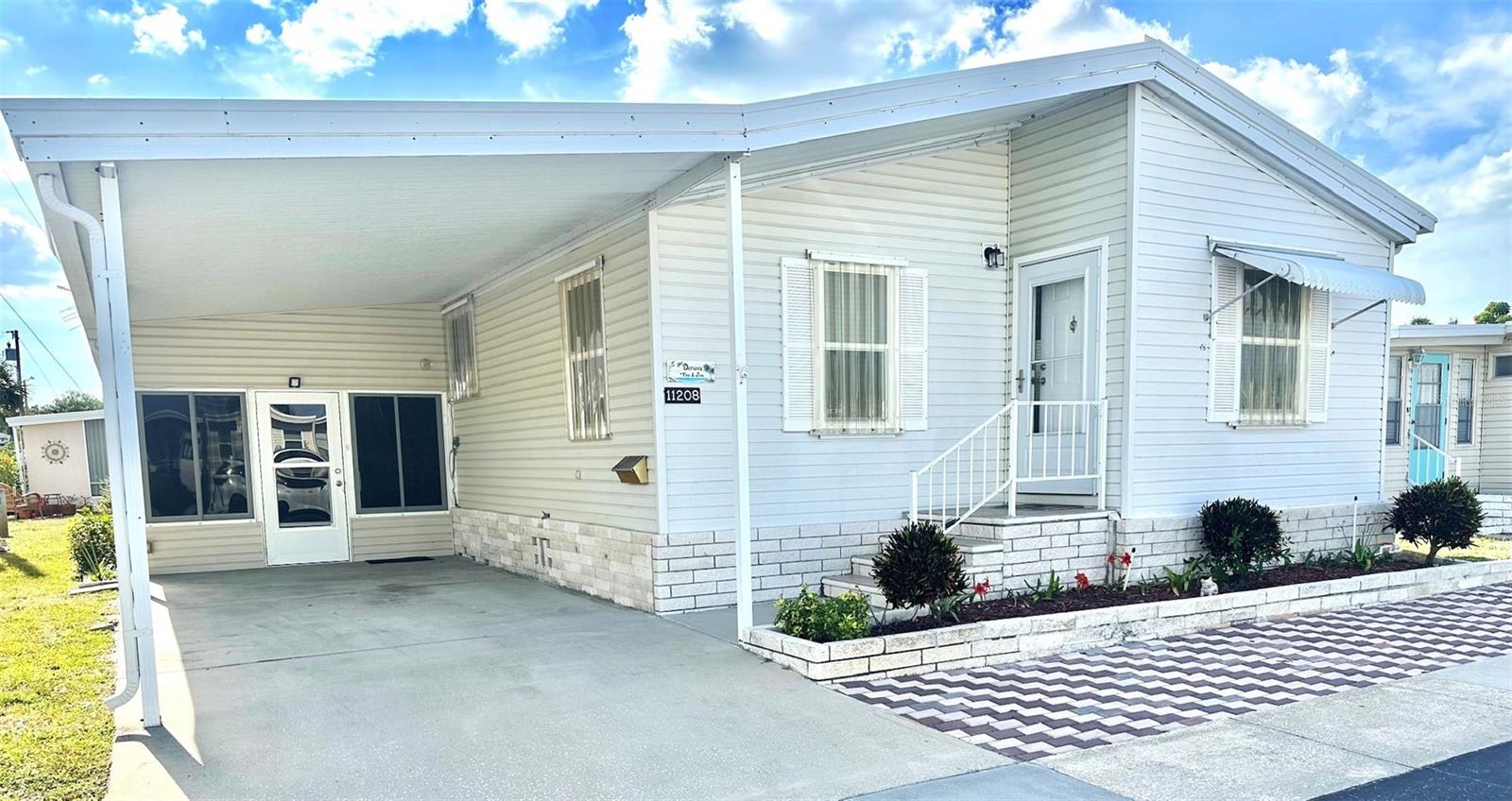 Hurry to see this Impressive 1997 2 bedroom, 2 bath, 1296 sq. ft. Palm Harbor Model Home, with all the upgrades! Inviting Glass enclosed 12x20 Florida Room, to enjoy your mornings! Spacious 12x12 Workshop/Shed, with updated Washer/Dryer! All attractive laminate flooring throughout, cathedral ceilings, newly added double pane tinted windows, and updated insulated metal Roof Over! All brand new Central Air/Heat Unit, with warranty! Convenient plexiglass storm window awnings included! Large Master bedroom ensuite, with built-in dressing table and private shower/commode area. All drywall interior, inside bonus room - optional laundry. So many upgrades to see! Large & Open Designer Kitchen, with plenty of room for your entertaining and holiday parties! Come see this beautiful and popular 5 Star, 55+ Active Resident Owned Community, located right on the large Lake Seminole! Bring your ski boat & fishing gear! Impressive large heated pool & Hot Tub to enjoy, with fun activities always going on! Only minutes to the beaches, golf courses, airports, medical, shopping, and all you would want! See Lake Seminole Resort website for more pics & info. Cash only! Asking $196,500., includes the $55k share! Low $212. mo fee. Small pet ok.