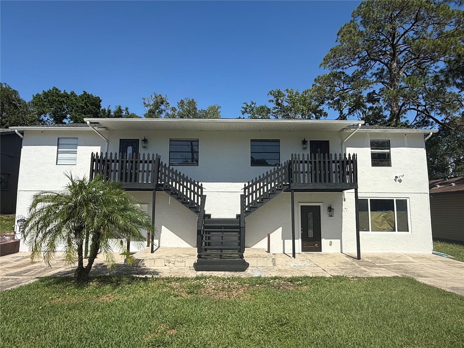 Look no further! This spacious, freshly painted second story apartment is located in Port Richey.  Featuring 2 Bedrooms and 1 Bathroom with ceiling fans throughout. The kitchen features a built in pantry, range, refrigerator and stackable washer and dryer nearby.  The great room has more than enough space for a dining area.   2 generously sized bedrooms featuring ceiling fans, closets and lots of natural light.  Enjoy a patio, lots of green space and a fenced in back yard.  Located near, restaurants, doctors offices, shopping, hospitals, beaches, and airports.  Enjoy Florida living in Port Richey.  Schedule your showing today.
