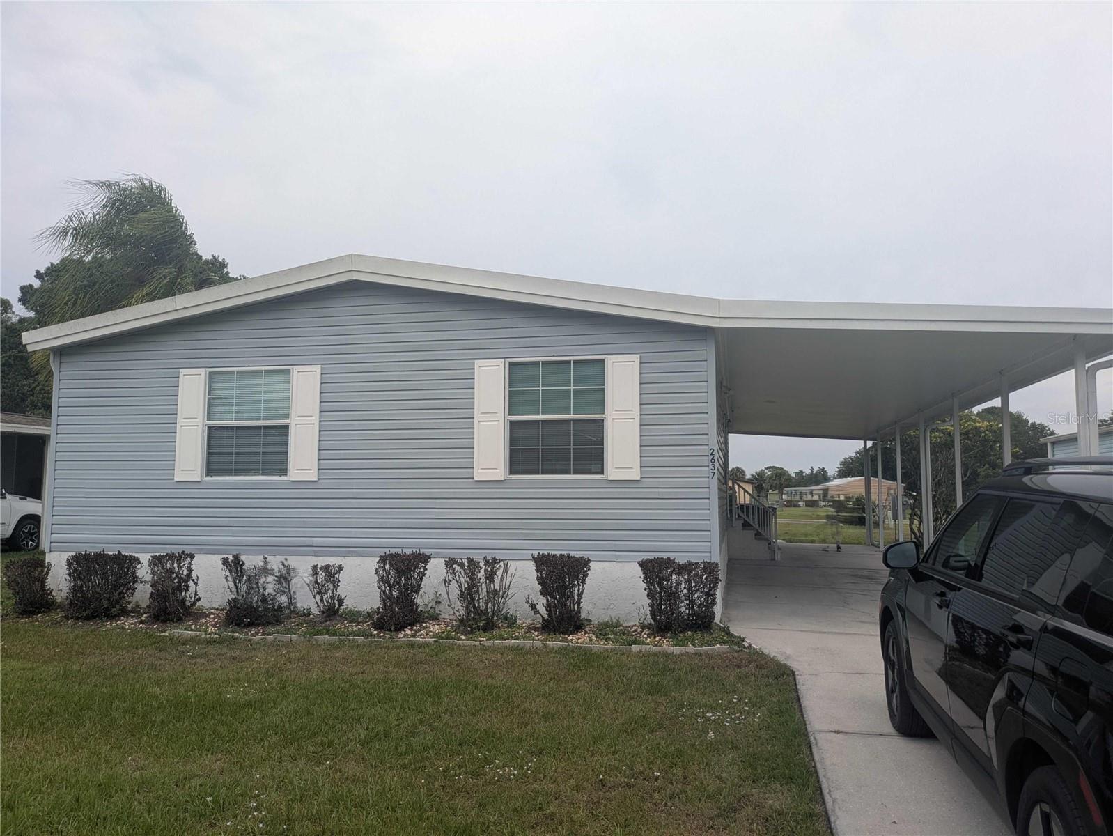 Attention buyers, investors, landlords, fix-and-flippers, and handy homeowners! This 3-bed, 2-bath double-wide mobile home in Osceola County has a great value-add opportunity in the Kissimmee/Poinciana corridor.

Situated on a 0.17-acre lot, the property features a functional floor plan, enclosed porch, attached storage/workshop shed, carport, and washer/dryer hookups. Newer roof —an important improvement already in place for the next owner.

Sold AS-IS and currently vacant, this property has strong potential as a rental, flip, or affordable owner-occupant home. Conveniently located near shopping, schools, parks, museums, major roadways, Orlando International Airport, and Kissimmee Gateway Airport.

Highlights:

You Own the Land (No Lot Rent)
0.17 Acres
Newer Roof
Enclosed Porch
Storage/Workshop Shed
Carport
Strong Rental Potential

Don't miss this opportunity in a rapidly market!