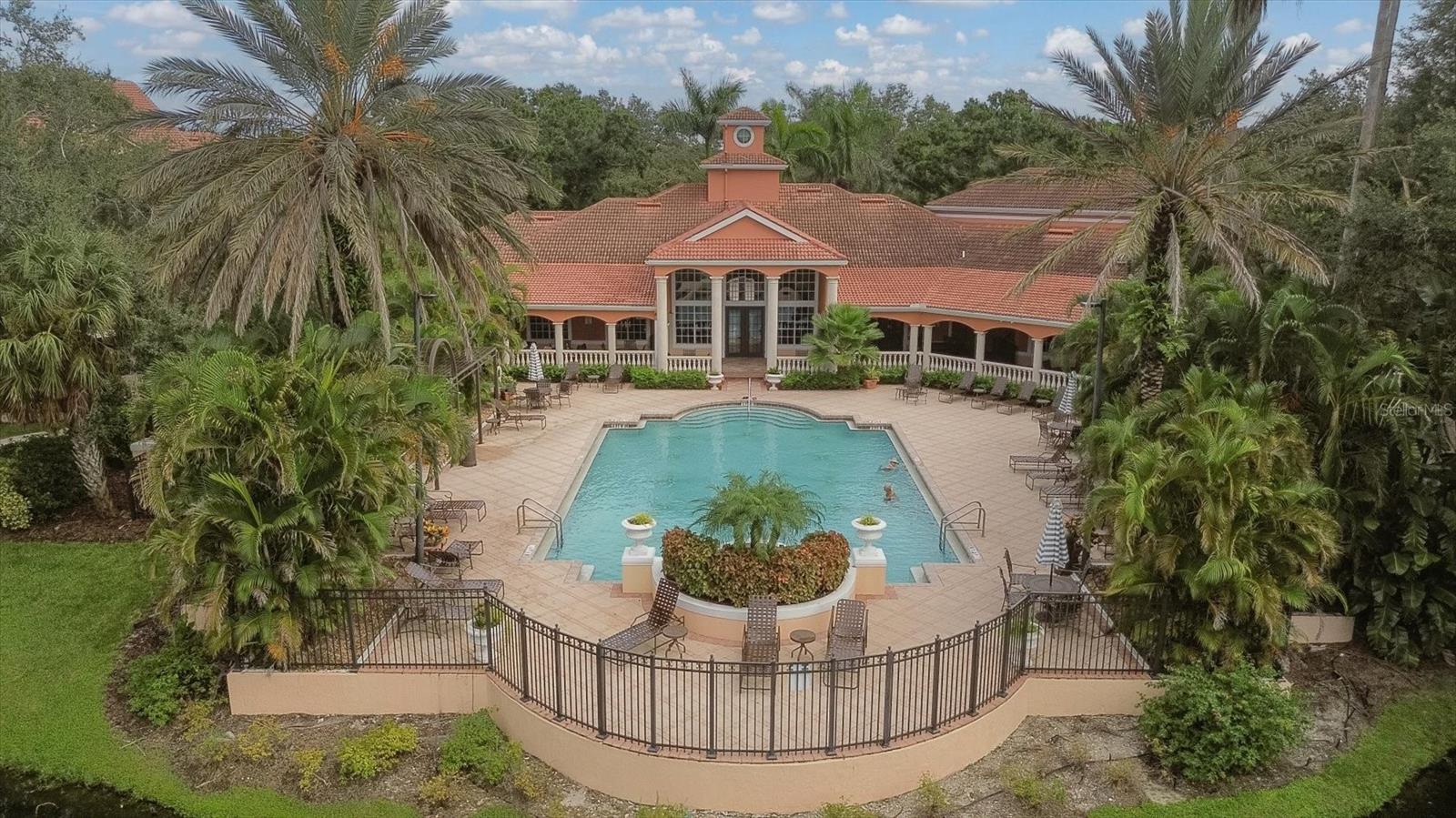 Virtually Staged. Live the Florida Resort Lifestyle at an Incredible Value!

Welcome to Bella Villino, a gated, resort-style condominium community located in the heart of Palmer Ranch. This beautifully designed 1-bedroom, 1-bath loft-style residence offers nearly 950 sq. ft., making it the largest one-bedroom floor plan in the community.

Step inside and feel the openness created by vaulted ceilings and abundant windows that fill the home with natural light. The impressive 12' x 28' great room/sunroom offers incredible flexibility—perfect for a guest sleeping area, daybed or Murphy bed, home office, or relaxing sunroom retreat.

The open layout features a spacious kitchen with breakfast bar, dining area, and separate laundry room for everyday convenience. As a desirable end unit with no neighbors above or below, you’ll enjoy extra privacy and quiet. A covered carport and abundant guest parking are included.

Step just outside and down a short flight of stairs to a peaceful outdoor gathering space featuring gas grilling stations, a tranquil pond with fountain, and a bench to relax and take in the scenery. A sidewalk leads directly to the resort-style pool, making it easy to enjoy the amenities without ever getting in your car.

Recent upgrades include hurricane-impact windows, new AC (2023), and new water heater (2024). A new roof is scheduled for 2027 with no assessment expected.

Residents of Bella Villino enjoy lush tropical landscaping and exceptional amenities, including a heated resort pool and spa, elegant clubhouse, state-of-the-art fitness center, indoor racquetball and basketball courts, tennis, pickleball, billiards, game room with foosball, business center, library, outdoor gathering areas, and multiple grilling stations.

Ideally located just minutes from the world-famous Siesta Key Beach and the scenic Legacy Trail, with easy access to shopping, dining, marinas, and entertainment.

Whether you're looking for a full-time residence, seasonal getaway, or lock-and-leave Florida retreat, this spacious loft-style home offers resort living at an exceptional price. Don’t miss this opportunity to enjoy the Florida lifestyle while it lasts!