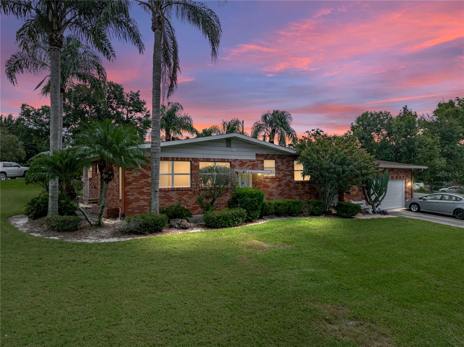 Welcome to this well-maintained 3 bedroom, 2.5 bathroom home situated on a corner lot with no HOA. The home features beautiful hardwood floors in the living room and dining room and an updated kitchen. The bathrooms inside have updated cabinets. The primary bedroom has a full bath with double sinks and shower. The second bedroom has a shared half bathroom with toilet/sink and sliding door access to the shared second bathroom that is accessed from the hall for guests and third bedroom. The oversized garage offers additional room for storage or a workshop it also has a separate room for the laundry. There is also a partial bath (toilet and shower) for convenient clean up after a weekend project. Enjoy outdoor living in the fenced backyard, perfect for relaxing or entertaining. Recent updates include a roof replacement in 2025 and updated hot water heater and windows providing added peace of mind. It is conveniently located near shopping, dining, and close to Polk Parkway for commuting to Tampa or Orlando. Close to Cleveland Heights Golf Course and Lakeland Tennis Courts. This home combines comfort, style, and functionality in one perfect package. Schedule a showing today and make this house your home.