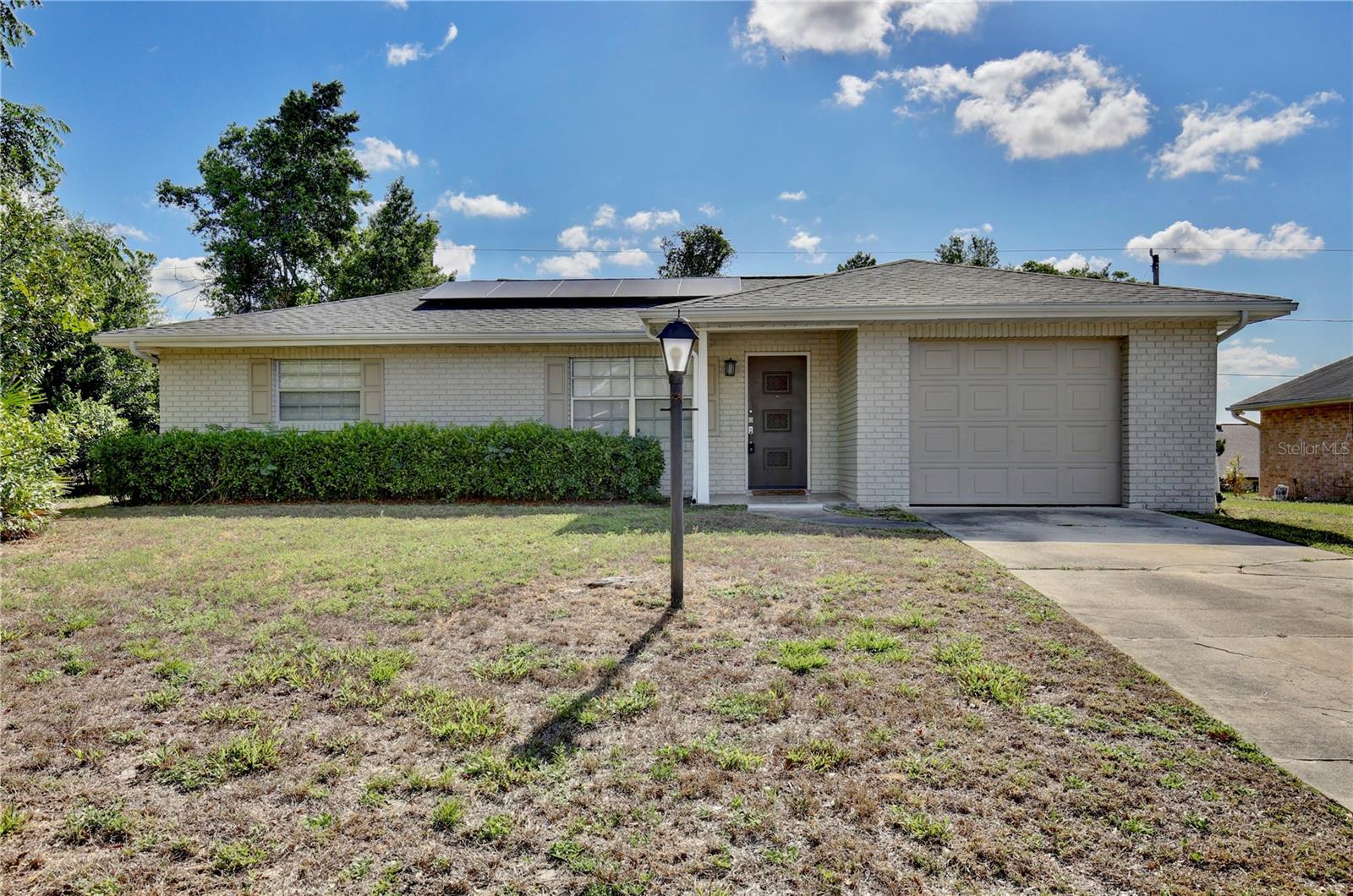 This charming 2-bedroom, 2-bath home at 1847 Fayetteville Ave, Deltona, FL 32725 ( POWER AND WATER INCLUDED IN RENT )offers comfort and convenience in a peaceful neighborhood. Featuring an updated kitchen with granite countertops and stainless steel appliances, a spacious living area, and a screened-in patio overlooking a large backyard, it’s perfect for relaxing or entertaining. Located just minutes from I-4, it provides easy access to Orlando, Daytona Beach, and nearby local favorites like Lyonia Preserve, Veterans Memorial Park, and shopping centers. This is an ideal rental!