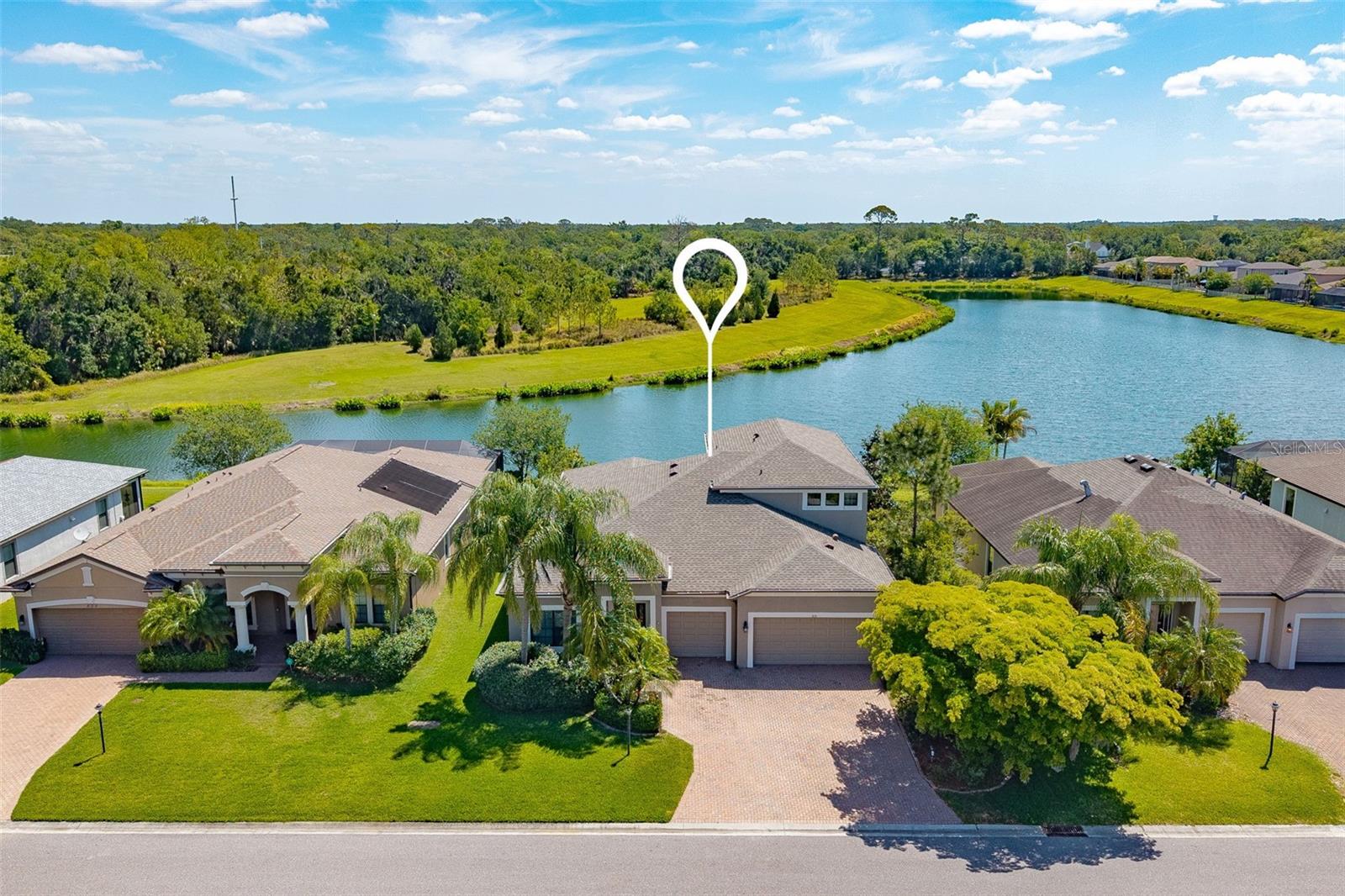 One or more photo(s) has been virtually staged. NEW ROOF 12/2024! Exceptional home with breathtaking pond & preserve views and a resort-style 38x14 heated saltwater pool with travertine deck—your private outdoor oasis! This open-concept home showcases a designer gourmet kitchen with double ovens, built-in cooktop (2026), quartz island (seats 6), backsplash, and newer fridge/dishwasher (2022)—perfect for entertaining.

Elegant linen ceramic tile flows through the main living areas, with upgraded LVT in all bedrooms. The luxurious primary suite features an oversized walk-in shower and custom closet system. All main-floor baths offer walk-in showers; upstairs bath includes a tub.

A massive ~800 sq ft loft/bonus room with tray ceiling and dual closets provides incredible flexibility for a media room, office, or guest retreat.

Loaded with upgrades: built-in fireplace, crown molding, upgraded baseboards, and premium exterior paint (2019). Outdoor kitchen and water softener rough-ins already in place. Meticulously maintained, including annually sealed driveway.

Prime location! Minutes to shopping (COSTCO, TARGET, WHOLEFOODS), dining, I-75, and within 1 hour of major airports (TPA, SRQ, PIE).
NO CDD FEES! LOW HOA