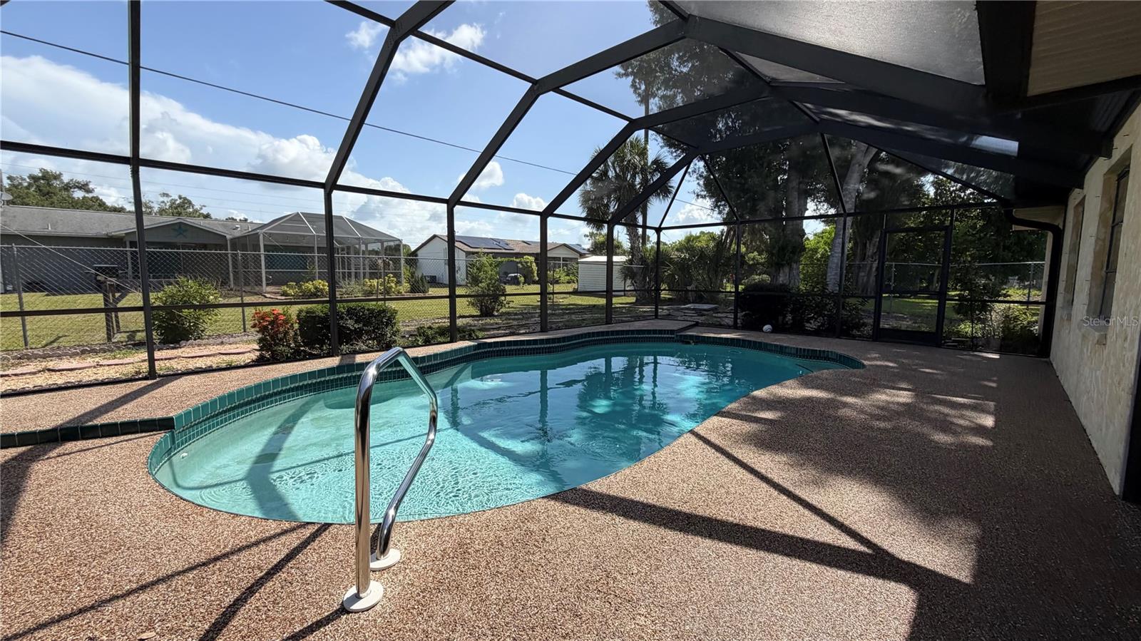 Beautifully updated 3/2 pool home is ready for immediate move in! Lots of pluses on this one! Big gated second driveway is perfect for storage/trailer parking, large outdoor walking area around the back yard, so cool! Hang out by the pool with a nice shaded lanai and nicely sized pool. Inside, find brand new paint, flooring, kitchen counters, and fixtures! Even the garage floor is beautifully epoxied! This one is a must see!