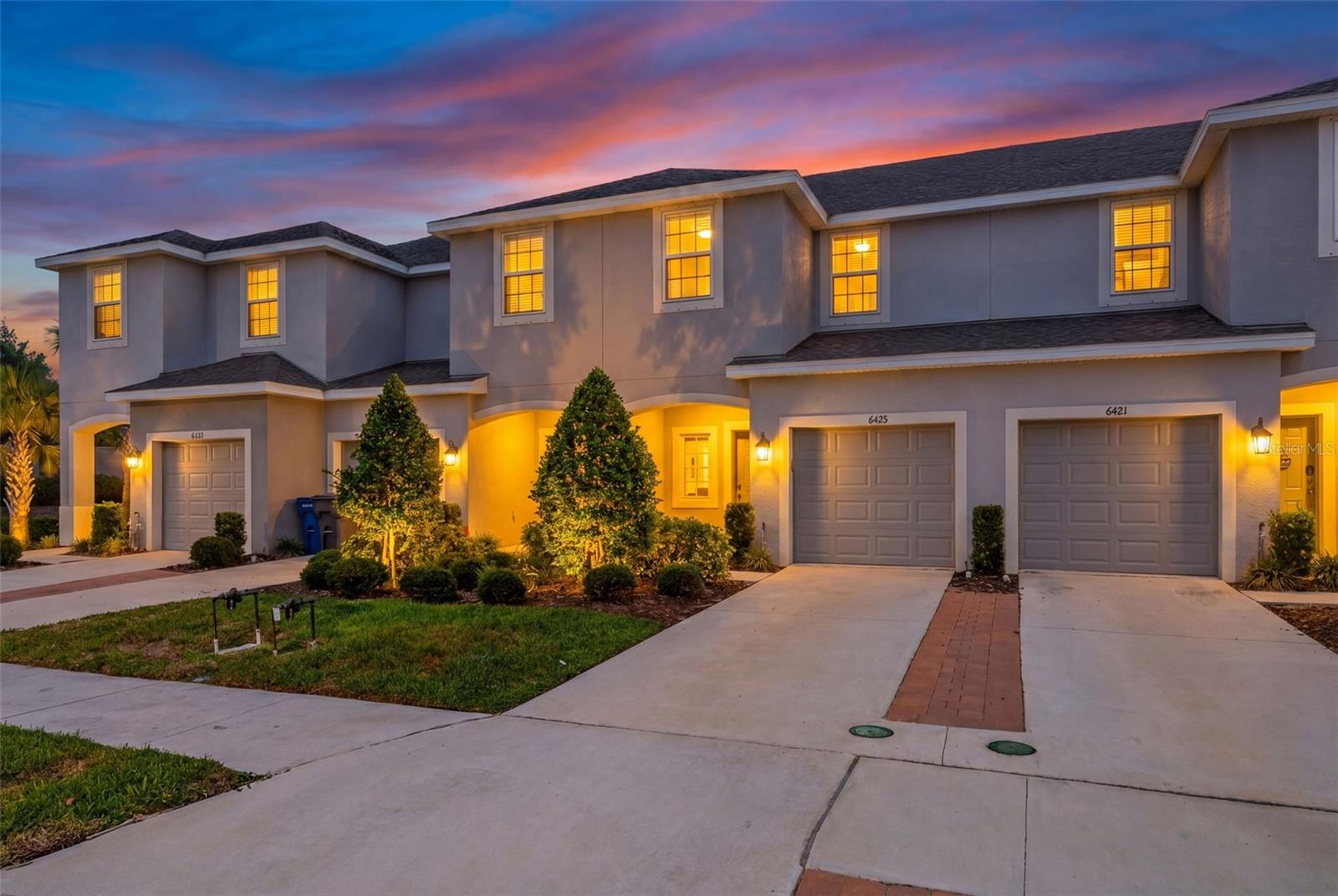 One or more photo(s) has been virtually staged. "Peaceful Retreat" - Rare opportunity to own a townhome in the sought-after Edgestone at Artisan Lakes community, where homes rarely become available! Built in 2022 by Taylor Morrison, this beautifully maintained townhome offers a spacious layout, stylish finishes, and a peaceful backdrop of wooded trees that creates a relaxing, private vibe. Tucked near the back of the community, you’ll love relaxing on the screened lanai while enjoying the quiet natural surroundings.

The open-concept floor plan creates an easy flow between the living, dining, and kitchen areas, making the space feel bright, welcoming, and perfect for entertaining. The kitchen features gray shaker cabinets, quartz countertops, stainless steel appliances, a blue glass tile backsplash, and a charming shiplap accent wall at the island for a fun designer touch. A convenient half bath is located downstairs, and the entire first floor is finished with tile flooring for easy upkeep.

Upstairs, the primary suite is privately situated at the rear of the home and includes a walk-in closet and en-suite bathroom. Two additional bedrooms and a shared hallway bath are located toward the front of the home, along with a laundry closet complete with washer and dryer. Brand-new carpet throughout the upstairs adds a fresh, move-in-ready feel.

The HOA covers exterior insurance, exterior maintenance, landscaping, irrigation, community pool maintenance, and escrow reserves, helping make for low-maintenance living. According to HOA documents, leasing is allowed immediately with no ownership waiting period, with a minimum lease term of 7 months. 

Located just minutes from the interstate, commuting to St. Petersburg, Tampa, and Sarasota is quick and convenient. You’ll also enjoy being close to restaurants, shopping, and the exciting new lagoon community opening soon for even more fun close to home!