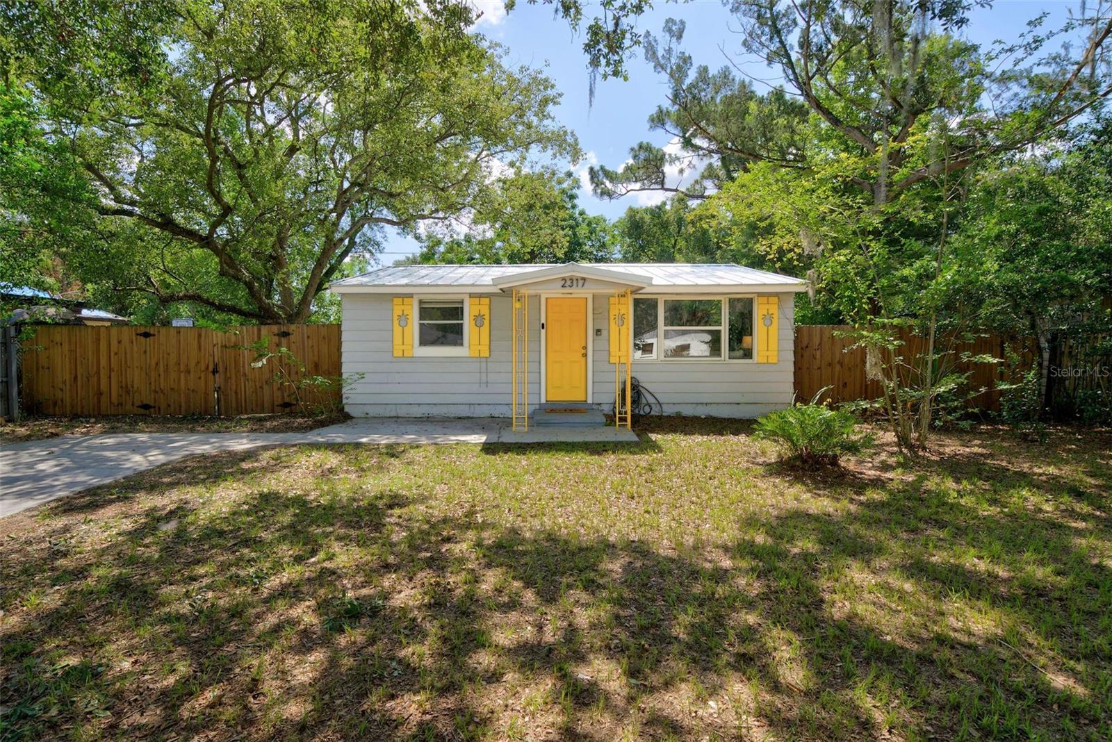 Your dream of affordable homeownership starts here! This charming two-bedroom, one-bathroom home offers 725 square feet of thoughtfully designed living space, combining low-maintenance comfort with an unbeatable location in the heart of Sanford. Inside, vaulted ceilings create an open and airy feel, while durable tile flooring extends throughout the home. The kitchen features honey-toned wood cabinetry, granite countertops, stainless steel appliances, a pantry, and plenty of workspace for everyday living. The primary bedroom includes a ceiling fan and convenient above-storage cabinetry, while the updated bathroom offers a granite-topped vanity, a beautifully tiled walk-in shower, and an included stackable washer and dryer.  Step outside to a spacious 120' x 70' fully fenced backyard, updated in 2024 with a double gate, making it perfect for pets, recreational vehicles, or outdoor entertaining. New sod installed in 2025 complements the expansive yard, while the custom tiki hut creates the perfect setting for relaxing with family and friends. An updated driveway completed in 2019 adds to the home's curb appeal.  The true highlight of this property is its exceptional location, offering a lifestyle that's hard to match. Enjoy being just minutes from historic Downtown Sanford, where you'll find locally owned restaurants, breweries, boutique shopping, waterfront dining, and year-round community events. Spend weekends exploring the Downtown Sanford Marina or launching your boat from the nearby City of Sanford boat ramps. Outdoor enthusiasts will love the easy walk to Wynnewood Park, James Dunn Park, and Roseland Park, offering playgrounds, basketball courts, picnic and BBQ areas, scenic ponds with fountains, and even the area's beloved peacocks and wild ducks. Commuters will appreciate being just seven minutes from Sanford Orlando International Airport and approximately ten minutes from both I-4 and SR-417, providing easy access throughout Central Florida. Best of all, Florida's beautiful east coast beaches are only about 30 minutes away, making this home an outstanding opportunity to enjoy everything the Sanford lifestyle has to offer.
ROOF - 2020(metal) HVAC - 2019