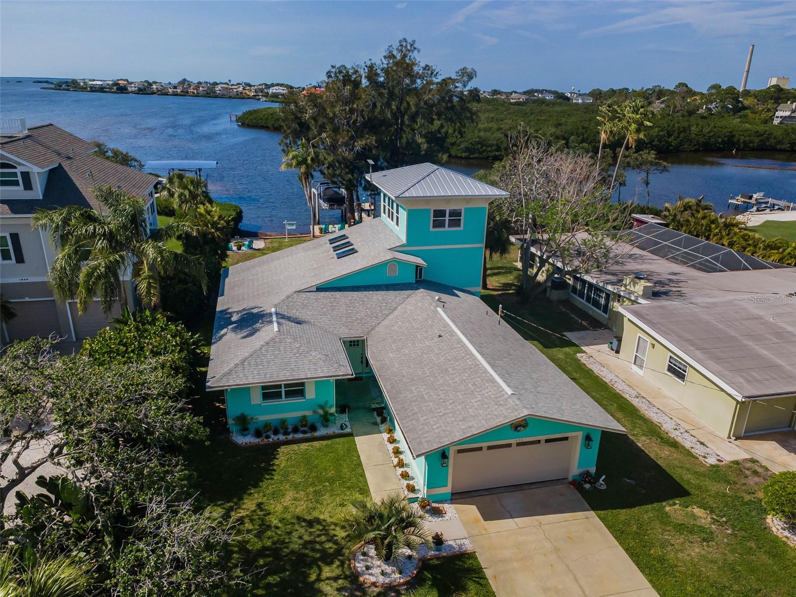 A Rare Gulf-Front Estate Defined by Elegance, Privacy, and Coastal Artistry
Set along the pristine shoreline with direct access to the open Gulf, this exceptional three-story custom residence offers a level of refinement and tranquility rarely found. Designed to capture both the grandeur of the water and the intimacy of coastal living, every element of this home has been thoughtfully curated.
Spanning over 3,100 square feet, the interior reveals a seamless blend of sophistication and comfort. A bespoke chef’s kitchen anchors the home, featuring quartz surfaces, custom cabinetry, Café designer appliances, and a statement copper hood. Expansive living spaces transition effortlessly into a fully enclosed, heated indoor pool—where walls of hurricane-rated glass dissolve into breathtaking Gulf views.
Above, the third-floor lookout bar and private balcony create an elevated retreat—ideal for sunset entertaining or quiet reflection above the water.
Outdoors, the property transforms into a private waterfront sanctuary. A 2021 custom dock with maintenance-free wear decking and an 8,000 lb lift provides immediate access to the Gulf. Surrounding it, expansive entertaining spaces include a fire-pit lounge, outdoor shower, and thoughtfully preserved Australian pines that frame the property with natural beauty.
Suspended between two of these majestic pines, a custom swing overlooks the water—offering a rare, almost cinematic vantage point for experiencing the Gulf’s most spectacular sunsets.
Additional features include a hurricane-rated smart garage door, two-car garage, central air with supplemental mini-split systems, and premium finishes throughout.
Moments by boat from renowned waterfront destinations, yet privately positioned to feel worlds away—this is more than a residence.
It is a statement of lifestyle, design, and location that cannot be replicated.
