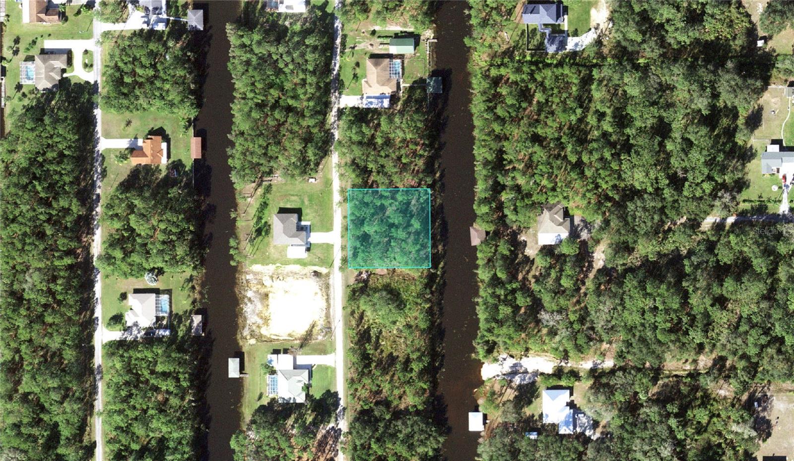 0.50 acre CANAL lot directly on the paved road. Located in the lake community of Indian Lake Estates, a golfing, fishing and boating community in the center of Florida. The canal allows you to have your boat right behind your house, just a couple minutes cruise to the 7,500 acre lake. An environmental report of this lot has been done for you already. Indian Lake Estates is about 20 miles east of Lake Wales. GPS Coordinates to center of property: 27.808644, -81.378069. Enter coordinates into google or apple maps for directions. Listing address is not an official address and is just for listing purposes. The community surrounds the 7,500 acre lake locally known as Lake Walk In Water, nationally known for its fishing and considered to be one of the best bass fishing lakes in all Florida. The lake has a beach, boat ramp, boat marina and the longest freshwater Fishing pier in the State of Florida. The pavilion is located at the front of the pier and is complete with propane grills and covered picnic tables. The community amenities include an 18-hole golf course, basketball and tennis courts, 23,000 sq.ft. clubhouse, cafe, post office, churches, library, fitness room and pro shop. If you love nature and the peace and quiet of the country you're in luck. Wildlife is plentiful! You will see deer, raccoon, turkey, turtles, cranes and various species of birds that call Indian Lake Estates their home. Orlando and Disney is only about an hour's drive north and Tampa, Busch Gardens, and the Gulf's pristine beaches only a little over an hour west. Historic Bok Tower, a National Landmark, is in nearby Lake Wales. The Westgate River Ranch Resort and Rodeo is just six miles away. An authentic Florida dude ranch and full-service resort offering guests the opportunity to experience "Old Florida." Encompassing 1,700 beautiful acres, Westgate River Ranch features horseback riding, wildlife airboat and swamp buggy rides, Saturday night championship rodeo, trap/skeet range, nature hikes, petting farm, marina, Adventure Park with zip line and rock climbing wall, Westgate Smokehouse Grill and River Ranch Saloon and much more. Cowboy-themed accommodations range from ranch-themed lodge guest rooms and deluxe lodge suites to spacious cottages, two-bedroom cabins, Glamping and Luxe Teepees. Come out and see how great life can be at Indian Lake Estates! Polk County's best kept secret!