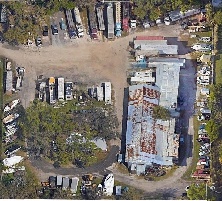 Rare opportunity to acquire an income-producing industrial property in one of Manatee County's established industrial corridors. Situated on approximately 2.77 acres, the property features a fenced gravel yard, an existing industrial building, and an additional concrete slab providing flexibility for a variety of industrial and contractor-related uses. Currently operating as an outdoor storage facility serving approximately 50–75 storage customers, the property generates existing income while offering significant upside potential for an owner-user, contractor, fleet operator, equipment storage operation, or Industrial Outdoor Storage (IOS) user. Conveniently located near Port Manatee, US-41, US-301, and Interstate 75. Property is available individually or may be purchased as part of a larger 4.78-acre assemblage with the adjacent property at 2125 17TH Street E.