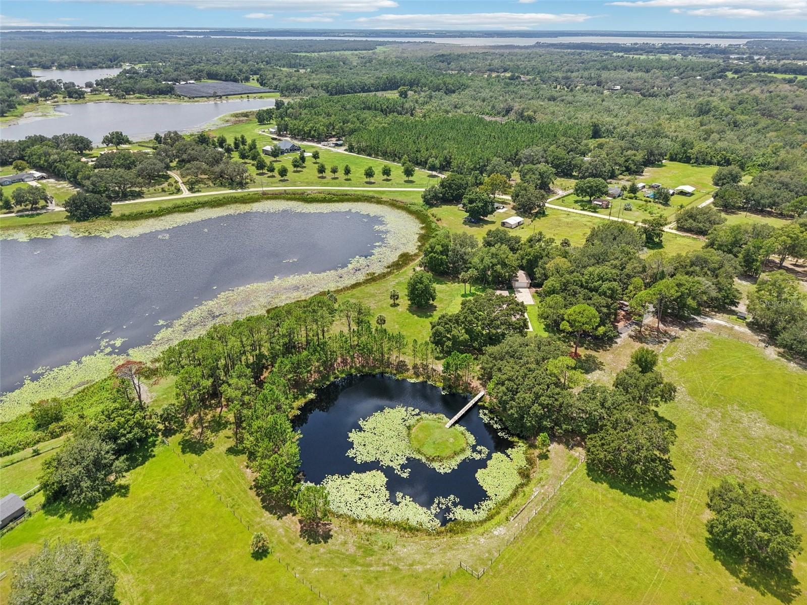 8.5 ACRES AG-ZONED COMPOUND + 4-CAR GARAGE | NO HOA | BUILD YOUR WORKSHOP HERE
THE "IMPOSSIBLE TO FIND" FLORIDA COMPOUND.

Stop looking for a house and start looking for a legacy property. Sitting on 8.51 acres of Agriculture-Zoned land with NO HOA, this 2015-built custom estate is not just a home—it is a blank canvas for your business, your toys, or your extended family.

THE LAND & FREEDOM:
Zoned Agriculture (Ag) means freedom.
• Business Owners: Need to park excavators, work trucks, or trailers? You have acres of open, high-and-dry pasture ready for your heavy equipment.
• The "Barndo" Dream: The property is primed for a massive 60x80 metal building, workshop, or barn.
• Multi-Generational Potential: With over 8 acres, this site is a prime candidate for a future Guest House (ADU) or second family dwelling (buyer to verify with Lake County). Stop squeezing your family into a subdivision and build your compound here.
THE TOY BOX (4-CAR GARAGE):
A car collector’s dream or a mechanic’s start-up. The additional garage/workshop offers massive storage for classics, boats, or a professional-grade workshop right off the kitchen.
THE ANCHOR HOME:
While you build your dreams outside, live in modern luxury inside. Built in 2015 (not a 1980s fixer-upper), this 2,048 sq. ft. home features soaring cathedral ceilings, zero carpet (tile/laminate throughout), and a wide-open floor plan designed for entertaining. The kitchen overlooks the family room, making it the perfect hub.
BONUS FEATURES:
• Private Boat Ramp: Launch your skiff or jet skis directly from your backyard into the private pond/lake access.
• Utilities: Private well and septic = NO water/sewer bills.
• Irrigation: Fed directly from the lake to keep your green space lush for free.
Located in the quiet privacy of Umatilla but just minutes from town. If you have outgrown your HOA, your driveway, and your storage unit—40610 Babb Rd is the answer. Schedule your private tour today.

Room to run your business from home
Space for equipment, RVs, animals, expansion
No HOA restrictions limiting your lifestyle
Create your own private estate or family compound