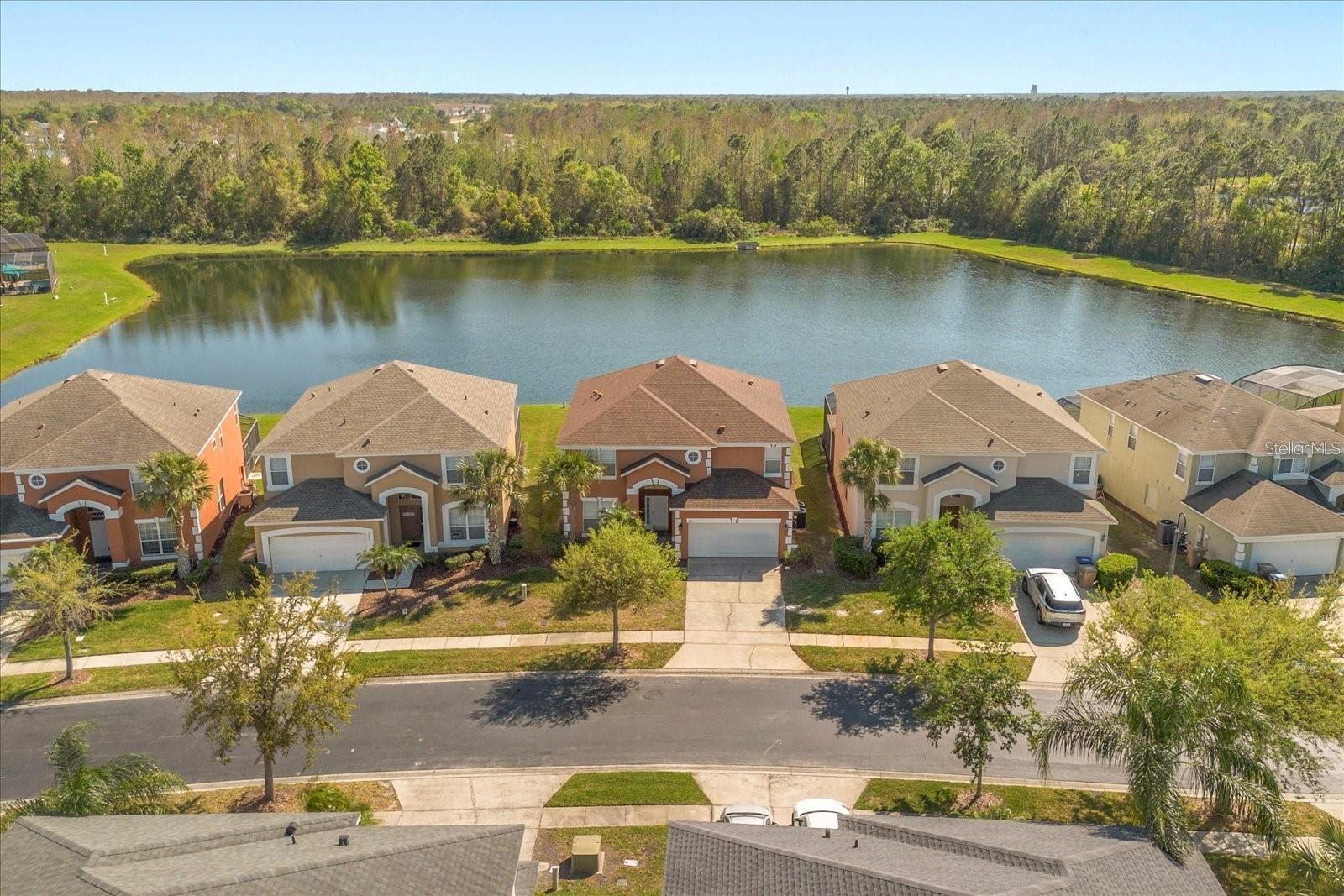 Stunning Water Views & Breathtaking Sunsets! Welcome to this beautifully updated 6-bedroom, 5.5-bathroom home located in the highly desirable 5-Star Terra Verde Resort, just 5 miles from Disney Springs and 1 mile from Medieval Times and Walmart. This exceptional property features soaring high ceilings, an open-concept floor plan, a fully remodeled kitchen, beautifully updated living areas, and a spacious first-floor primary suite overlooking the private pool and tranquil water views. Offered fully furnished and truly turnkey, this home is move-in and Airbnb-ready, making it an outstanding opportunity for a primary residence, vacation home, or income-producing short-term rental.

Step outside to your private screened pool and covered lanai, where you can relax while enjoying spectacular sunsets over the water. Residents and guests enjoy world-class resort amenities, including a zero-entry resort-style pool, clubhouse, Tiki Bar & Grill, fitness center, sand volleyball court, fishing lake, playground, and 24-hour gated security.

Recent upgrades include: Roof (2020), Pool Heater (2019), AC (2023), Flooring (2023), Patio Sliding Glass Door with Inside-Mount Blinds (2023), Window Treatments (2024), Interior & Exterior Paint (2025), and Appliances (2025).