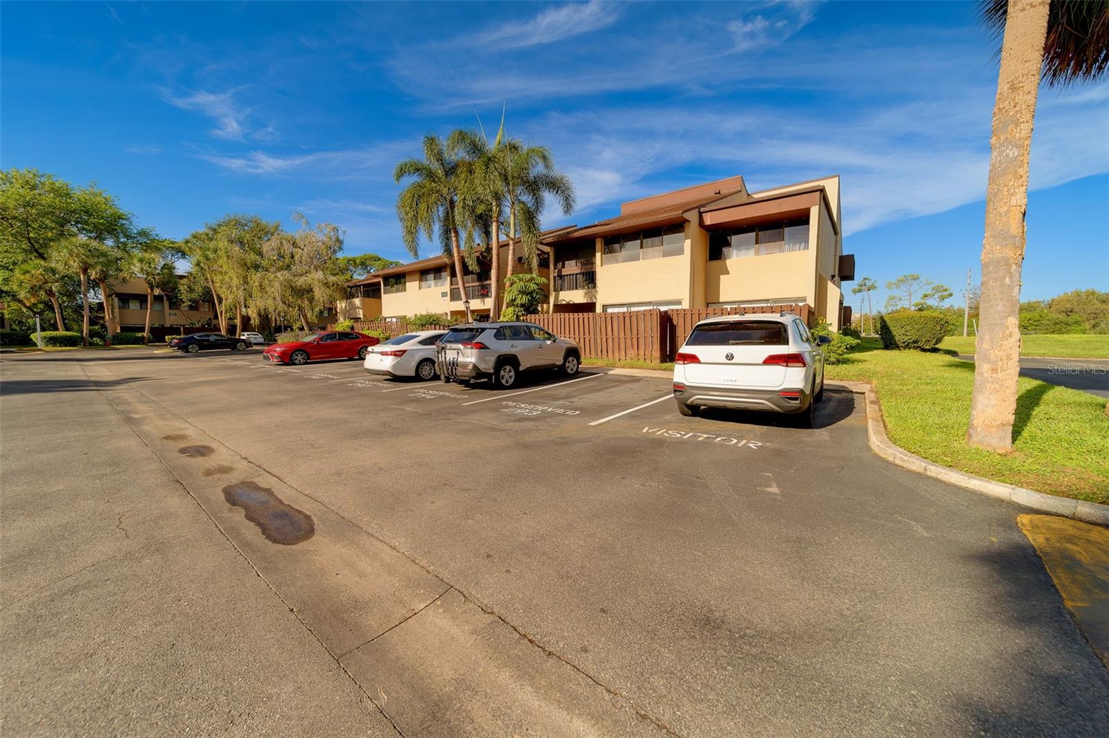 Welcome to this updated 1-bedroom, 1-bathroom first-floor unit located in the highly sought-after Village Lake Condominium community. This move-in ready condo features all-tile flooring throughout, making maintenance a breeze and offering a clean, modern look. Enjoy your own private outdoor oasis with a fenced-in patio and a screened-in lanai—perfect for relaxing, entertaining, or letting your pets enjoy the fresh air. The kitchen has been tastefully upgraded with stunning quartz countertops and a butcher block pass-through to the spacious living area, creating a seamless flow for dining and entertaining. The generously sized bedroom includes a walk-in closet, and the updated bathroom features a sleek, glass-enclosed shower. Village Lake offers a host of amenities, including a sparkling pool, pickleball and tennis courts, and assigned parking with plenty of guest spaces for visitors. Pet-friendly and perfectly located, you’ll be just minutes from I-275, Downtown St. Petersburg, Tampa, the Gulf beaches, and a wide variety of shops and restaurants. Don't miss out—schedule your private showing today!