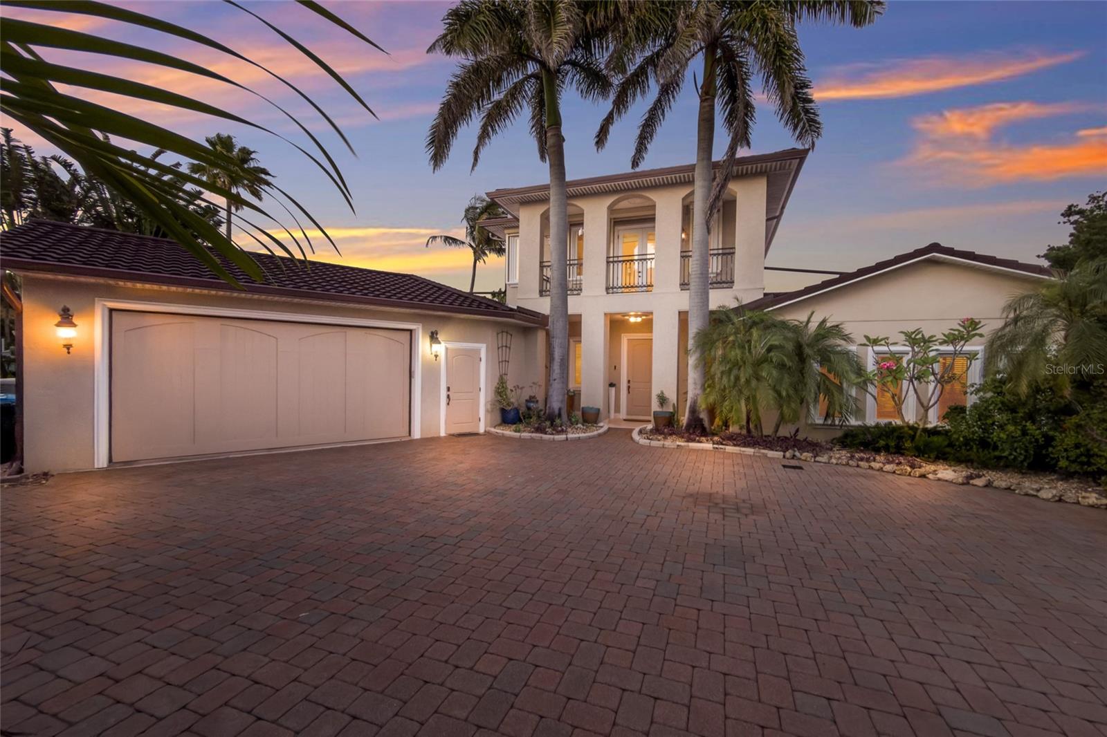One or more photo(s) has been virtually staged. Imagine arriving at a private estate tucked along the shimmering waters of Tampa Bay on Anna Maria Island, where 235 feet of pristine waterfront create a rare sense of space, privacy and uninterrupted views. This four-bedroom, six-bath coastal residence in Holmes Beach is designed to capture the beauty of the bay from nearly every angle. Expansive walls of glass and sliding doors frame panoramic water vistas, filling the home with natural light and bringing the outdoors in, a hallmark of luxury waterfront homes in this area. Inside, the home blends refined elegance with relaxed island living. A grand open-concept layout connects the living room, dining area and a chef’s kitchen outfitted with high-end appliances, custom cabinetry and generous entertaining space. Multiple living areas, often found in premier Anna Maria Island homes, offer flexibility for hosting guests or enjoying quiet retreats. Each of the four bedrooms is generously sized, while the six total baths provide a resort-style convenience ideal for family and guests. The primary suite is typically a sanctuary of its own, featuring water views, private balcony access and a spa-inspired bath. Outside, the property becomes exceptional. A resort-style pool and spa overlook the bay, surrounded by lush tropical landscaping and expansive outdoor living areas designed for entertaining or unwinding in the coastal breeze. Waterfront homes here often emphasize seamless indoor-outdoor flow, creating an island lifestyle experience. With 235 feet of frontage, the property offers a private dock and boat lift, ideal for direct access to the open waters of Tampa Bay and the Gulf beyond. Whether you’re setting out for a sunset cruise, fishing at dawn or simply watching dolphins and manatees pass by, the water becomes an extension of daily life. Set on one of the desirable stretches of Anna Maria Island, this home combines rare waterfront scale, luxury amenities and effortless boating access, a showcase of elevated coastal living.