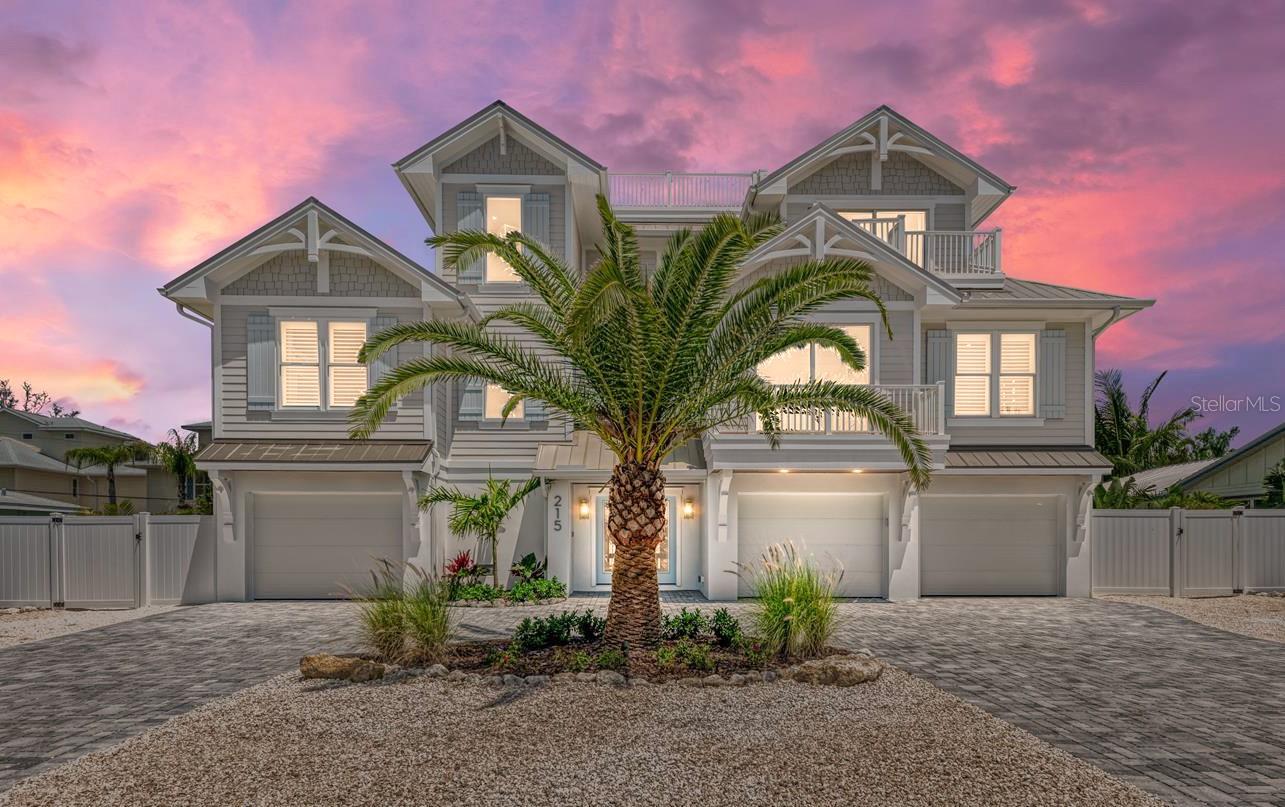 Sunsational is a freshly built & beautiful new home in Holmes Beach! This four bedroom, 4 and half bathroom pool home is impeccably built by Moss Construction and designed by award winning designer Emily Moss Designs. Which will be featured in Design Magazine soon, it's just THAT amazing!  The facade of this incredible home feels like luxury and the minute you step inside it won't disappoint.  The textures, the colors, the style of each room creates the perfect home for you to live and or continue renting as an investment home. They thought of everything and there is no lack of detail at every turn.  So many things to bring to light about this gorgeous home but one of the most prominent is the back yard. It's literally a space full of beauty and fun. It's Florida outdoor living at its finest. Games, heated pool and spa as well as enough balconies for everyone. The great room creates a space large enough for everyone to come together for dining, movies or anything else the family wants to do together. Sunsation also gives you and your family or guests the ability to get away into their own spaces. With a small media room with wet bar upstairs you can spread out to in case you just can't agree on a movie. There are numerous balconies to escape to and enjoy the warm air and great views of Holmes Beach. Every bedroom is large and cozy. Three of the bedrooms are en-suites and ready for and your guests and you must see the bunk room. EVERY youngster will dive into bed and love the feel of fun in this super creative use of space. Just 2.5 blocks to the coveted sugary beaches of Anna Maria Island. Spend the morning walking the beach, collecting shells and feel the ocean breeze. Come back from the beach and spend the day at a home you literally may never want to leave. If you do decide to venture out, you are a golf cart ride or a bike ride away from it all. Hop on the free Trolley and head out to all the hubs of each cities shops and restaurants. This home is amazing and you simply must come see your new home and start living the Anna Maria Life now!