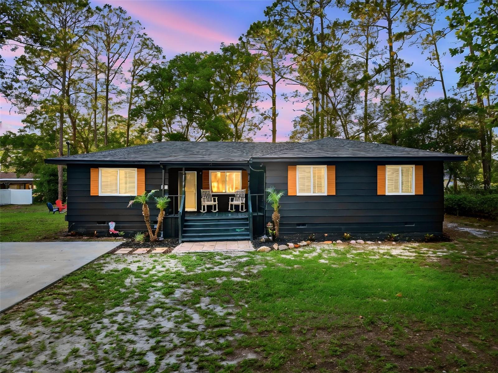Welcome to one of Deltona’s most sought-after areas, where charm, space, and convenience come together. Located near several beautiful lakes and just minutes from SR 415, this farmhouse-style home offers easy access to Orlando, area beaches, and everything Central Florida has to offer—all while maintaining a peaceful, tucked-away feel. Situated on an oversized .38-acre lot with NO HOA. The inviting front porch practically begs for rocking chairs and gives the home true farmhouse character, while the huge backyard is built for outdoor Florida living, featuring a large entertaining deck, a fire pit area, a storage shed, and endless room to spread out. Inside, the home has been well-maintained and features bamboo flooring throughout, stainless steel appliances, and remodeled bathrooms that add the perfect modern touch while preserving the cozy atmosphere. Major mechanical updates include a new roof in 2022 and a 2015 HVAC system. One of the biggest highlights of this property is the unbeatable location. Enjoy being within walking distance of Publix, Starbucks, Ace Hardware, and an array of nearby shopping and dining options, all while retaining excellent privacy and space. The oversized driveway also provides plenty of room for multiple vehicles, boats, RVs, trailers, or work trucks. Don't wait, schedule your showing today! All information is deemed to be accurate but is not guaranteed.