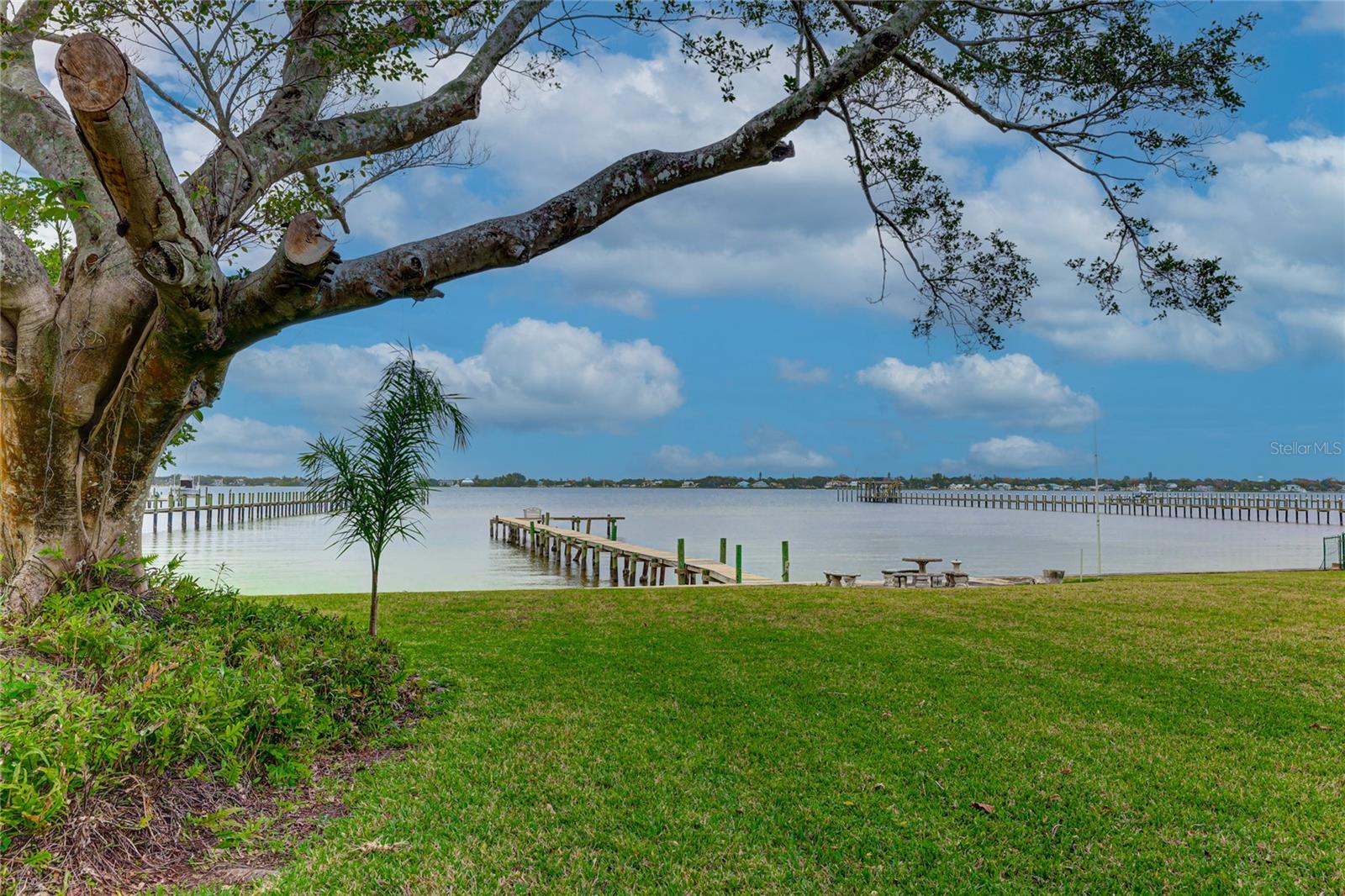 Riverview Boulevard on the Manatee River! Almost 130 feet of frontage with High Elevation on the Manatee River!
-3/2 Main Cottage
-1/1 Guest Cottage
-2 potential buildable lots
If living on the river is your End Game ... MAKE YOUR DREAM HAPPEN NOW! Remodel the History or Rebuild a New Story.

Priced at the value of the land, this property presents a grand opportunity for a riverfront estate homesite or the restoration of its enchanting "old Florida" style home. Featuring 3 bedrooms and 2 bathrooms, the charming residence showcases pecky cypress ceilings, a stone fireplace, and a spacious great room with added anterooms suitable for office space or morning rooms.  Included in the offering is a detached guesthouse and a two-car garage

This sought after location, adorned with granddaddy oaks, enjoys leisurely strolls through the historic river district  or easily bike to downtown for the weekly public market, festivals, and Riverwalk Park. Indulge in the vibrant cultural center with its theater, library, and array of restaurants and pubs. With minutes to the sandy Gulf beaches of Anna Maria Island and convenient access to St. Pete, Tampa, and Sarasota airports, this property offers a rare blend of tranquility and accessibility.