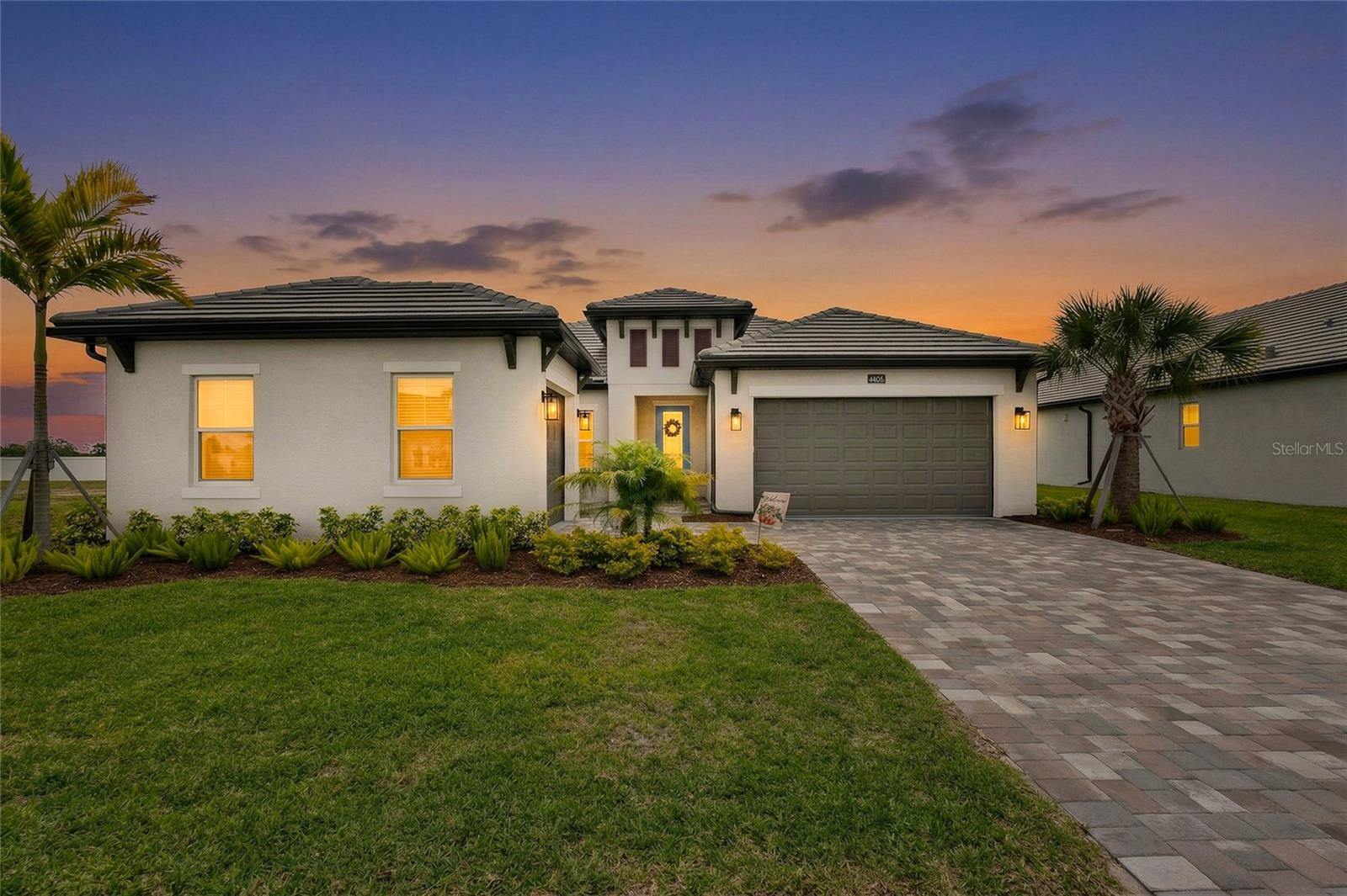 If you’ve been searching for a home that feels like new construction without the extra cost or unfinished details, THIS IS THE ONE! Located just 10 minutes from Nokomis Beach, this move-in ready home in Cassata Lakes offers the perfect balance of coastal convenience and everyday ease. It's just 1 mile from A-rated Laurel Nokomis K-8 School and 2 miles from Sarasota Memorial Hospital of Venice. This spacious 4-bedroom plus den, 3-bath home with a 3-car garage is thoughtfully upgraded beyond what the builder offers. Luxury plank vinyl flooring runs throughout the entire home with no carpet, creating a clean and cohesive look. The kitchen is both functional and elevated with pull-out drawers, built in wall oven, stylish hood range, walk-in pantry, quartz counters, under mount lighting and marble backsplash. Throughout the home you will find upgraded light fixtures, upgraded comfort-height toilets, custom bathroom mirrors, a custom primary closet system, and built in coat rack in the laundry room. Other notable upgrades include a decorative impact glass front door, rear-installed gutters, epoxy garage floor, spray foam insulation, plus added insulation above the garage for improved comfort and efficiency. Equipped with Smart Shield prewiring for cameras and live video, remote light access to turn lights on and off, electronic door locks, Smart thermostat and home security system. The property includes a 130' deep irrigation well to keep your lawn lush year around without running up your water bill. The outdoor space is plumbed and prepped for an outdoor kitchen or pool. Oversized lot with a virtual rendering showing large pool possibilities! Built with quality in mind, this home features impact windows, a concrete tile roof, and a paver lanai and driveway. These are the high-value items that truly matter when comparing new homes. Located in a gated community with low HOA fees and no CDD, this is ideal for buyers who want a well-kept neighborhood without paying for amenities they will not use. This home truly delivers!