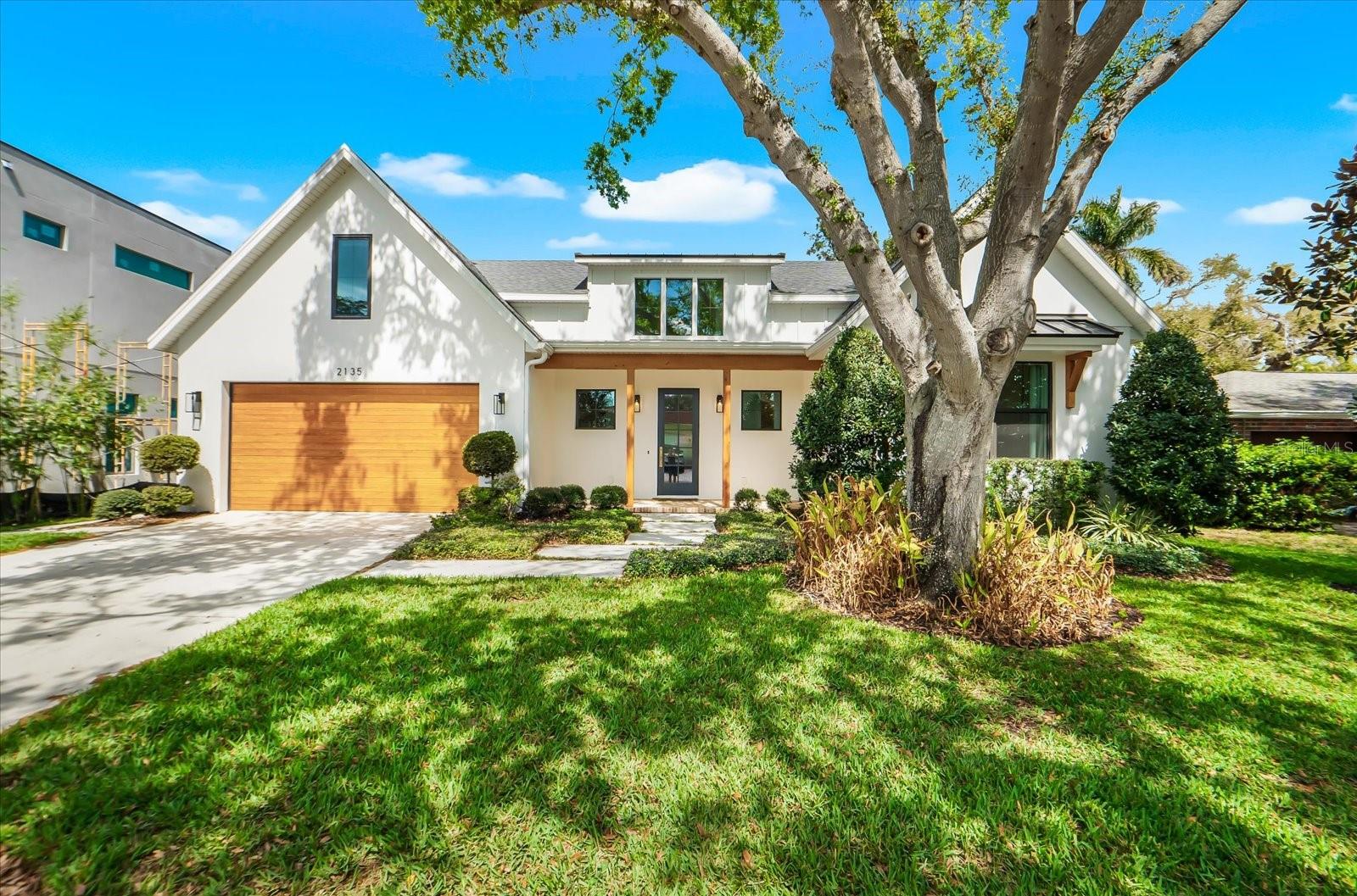 This exceptional custom-built residence seamlessly blends modern farmhouse design with superior craftsmanship and high-end finishes throughout. Offering 3 bedrooms, 2.5 baths, and an open-concept floor plan, the home delivers the perfect combination of style, comfort, and functionality in one of Sarasota’s most desirable locations.

Striking curb appeal is highlighted by a custom cypress garage door, cypress porch accents, and a dramatic glass entry that welcomes you into a thoughtfully designed interior filled with natural light. European oak flooring, recessed lighting, and refined architectural details create a warm yet sophisticated atmosphere throughout the two-story home.

At the heart of the residence, the spacious great room features soaring 12-foot vaulted ceilings accented by a decorative cypress beam and a sleek electric fireplace, creating an inviting space for both everyday living and entertaining. The chef-inspired kitchen is equally impressive, showcasing a Fulgor Milano dual-fuel range, Silestone quartz countertops, custom soft-close cabinetry, a waterfall-edge island, floating cypress shelving, designer brass fixtures, and a generous walk-in pantry.

The luxurious primary suite serves as a private retreat, complete with a custom walk-in closet and a spa-like bath featuring dual showers, double vanities, and custom cypress shelving. Additional highlights include beautifully crafted wood staircases with wrought-iron railings leading to a versatile second-floor bonus room, as well as a spacious laundry and mudroom offering abundant storage and workspace.

Outdoor living is equally appealing with a large, private backyard enclosed by a six-foot cypress shadowbox fence. With ample space for a future pool, the yard provides endless opportunities for entertaining, pets, and enjoying Florida’s year-round sunshine.

Ideally located east of the Trail, this remarkable home is just minutes from Sarasota Memorial Hospital, Southside Village, and highly regarded Southside Elementary School. Downtown Sarasota’s vibrant dining, arts, cultural attractions, and world-renowned Gulf beaches are all within easy reach, making this a rare opportunity to enjoy modern luxury living in a premier Sarasota location.