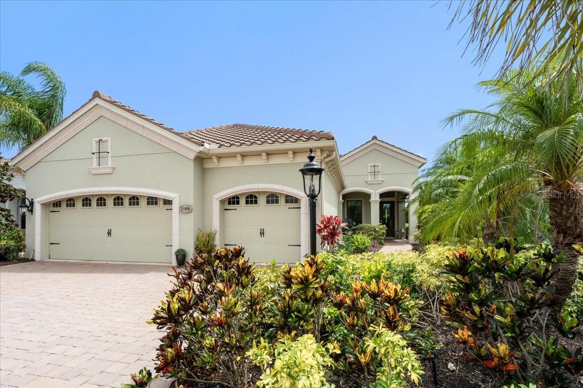 Welcome to an exceptional residence in the highly sought-after community of Country Club East, where timeless elegance, thoughtful design, and Florida luxury living come together seamlessly. This meticulously maintained 3-bedroom + den, 3-bathroom pool home offers an impressive blend of sophistication and comfort, perfectly positioned within one of Lakewood Ranch's premier gated communities.
From the moment you enter, you'll be captivated by the expansive open-concept floor plan featuring soaring ceilings, tray ceilings, crown molding, and an abundance of natural light. The spacious great room flows effortlessly into the gourmet kitchen, creating an ideal setting for both everyday living and entertaining. The chef's kitchen is beautifully appointed with a built-in oven, cooktop, range hood, stone countertops, premium appliances, ample cabinetry, and a generous eat-in dining area. A dedicated den/office provides the perfect space for working from home, a private library, media room, or flex space to fit your lifestyle needs. Thoughtfully positioned away from the main living areas, it offers both privacy and versatility. The luxurious primary suite serves as a private retreat, offering a spacious bedroom, spa-inspired bath, and oversized walk-in closets. A split-bedroom floor plan ensures privacy for family and guests, while each guest bedroom enjoys convenient access to a full bathroom. Designed for the ultimate Florida lifestyle, the home's disappearing sliding glass doors open to a stunning screened outdoor living area complete with a sparkling saltwater pool, outdoor grilling station, and multiple spaces for dining and relaxation. Whether enjoying a quiet morning coffee or hosting evening gatherings, the outdoor oasis provides the perfect backdrop year-round. Additional features include impact glass windows, hurricane shutters, natural gas service, a dry bar, built-in features, irrigation system, rain gutters, designer window treatments, and a spacious laundry room. Residents of Country Club East enjoy gated security, beautifully maintained grounds, and access to resort-style amenities while being just minutes from championship golf, upscale dining, shopping, entertainment, and everything that makes Lakewood Ranch one of the nation's top master-planned communities. This is a rare opportunity to own a beautifully crafted luxury home that embodies the very best of Florida resort-style living.