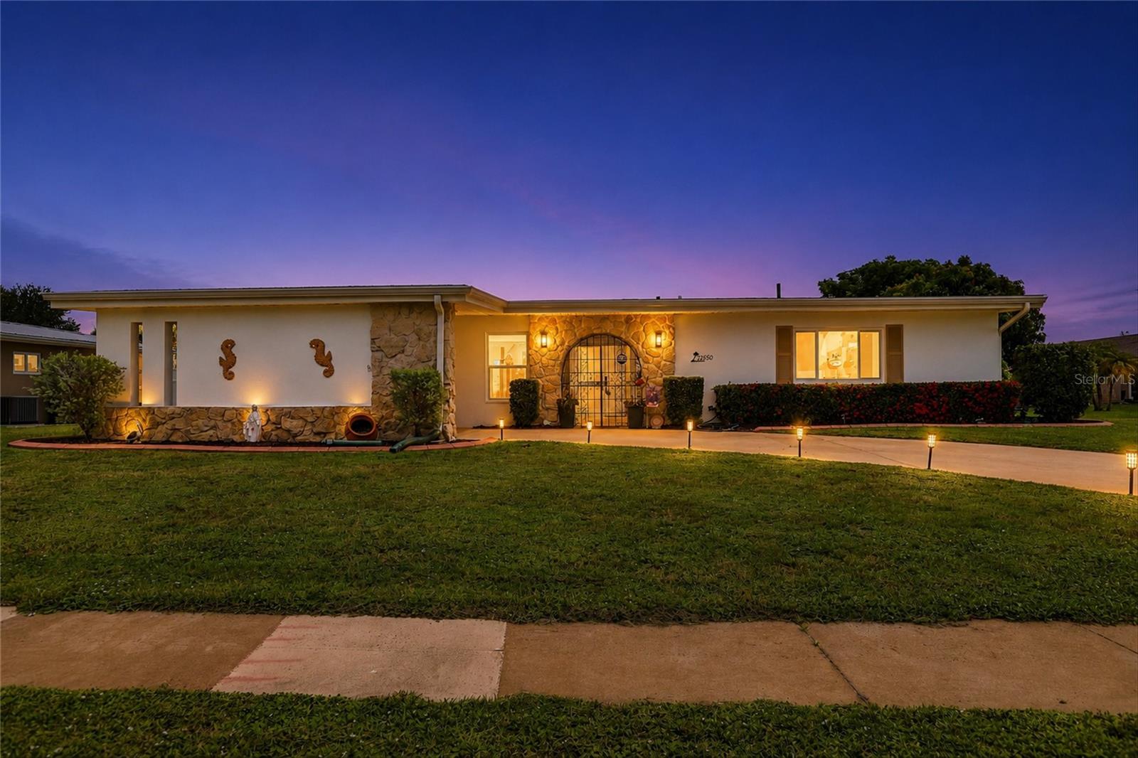 Welcome to 25580 Bolanos Court—a beautifully updated, move-in ready 3-bedroom, 2-bath home offering exceptional value in the charming town of Port Charlotte! Located in Flood Zone X, no flood insurance is required, providing added peace of mind. Public water and sewer, well water for irrigation!

This tastefully renovated home backs up to a former golf course, creating a serene setting and a beautifully landscaped backyard with epoxy floors on  Patio, stoned beds, so perfect for entertaining family and friends.  The spacious yard offers plenty of room to add your dream pool.  With NO HOA and NO deed restrictions, you’ll also appreciate the ample side parking for your boat, RV, or other recreational vehicles.

Step inside to discover a bright, open floor plan filled with natural light. The welcoming foyer leads to a spacious living room, formal dining area, and an inviting kitchen featuring matching color appliances, Corian countertops and a cozy breakfast nook that can easily serve as a home office, reading area, or additional flex space.  The home also offers a laundry room with a generous pantry, a screened lanai with tiled flooring, and an oversized patio for enjoying Florida’s year-round outdoor lifestyle.

The comfortable primary suite and guest bedrooms provide plenty of space, while the third bedroom is currently used as a home office/den, offering flexibility to fit your needs.

Recent updates include a New roof (2023), most windows are NEW (2023/2026)  upgraded to impact, resistant, hurricane-rated,  New blinds,  and New Flooring in the living room, dining area, and third bedroom/office.

Conveniently located just minutes from US-41 (Tamiami Trail)  and I-75, you’ll enjoy easy access to shopping, dining, medical facilities, golf courses,  Sunseeker Resort,  Historic Downtown Punta Gorda,  Fishermen’s Village,  Punta Gorda Airport, and some of Southwest Florida’s most beautiful Gulf beaches, including  Boca Grande, Englewood Beach, Stump Pass Beach State Park, and Venice Beach.

Don’t miss this wonderful opportunity to own a beautifully updated home in a fantastic location. Schedule your private showing today and discover why  25580 Bolanos Court is the perfect place to call Home Sweet Home!

Buyer Incentives:  Qualified buyers may receive a **FREE appraisal**, **zero underwriting fee**, and may be eligible for a **rate buy-down program** through the seller’s preferred lender. Contact the listing agent for complete details.