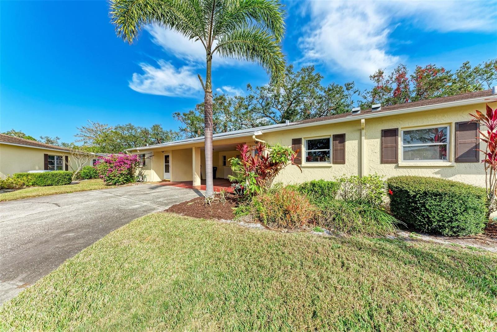 Welcome to your dream retreat! This stunning, fully remodeled condo is a rare find, combining high-end finishes with an unbeatable price. Step inside to discover luxury vinyl plank flooring and a brand-new kitchen complete with gleaming granite countertops and stainless steel appliances. The spacious primary bedroom features a stylish barn door leading to an updated bathroom, complete with a wheelchair-accessible shower for ultimate convenience. Unique glass slat doors add a modern touch, while the glassed-in lanai offers the perfect spot to unwind and soak in the Florida sunshine. A washer and dryer in the carport make laundry a breeze. Enjoy resort-style living with fantastic amenities, including a pool, pickleball courts, shuffleboard, and a vibrant clubhouse designed for active 55+ living. Centrally located near shopping, dining, and downtown, this condo is ideal as a second home or your forever oasis. Don’t wait—schedule your showing today and make this exceptional property yours!