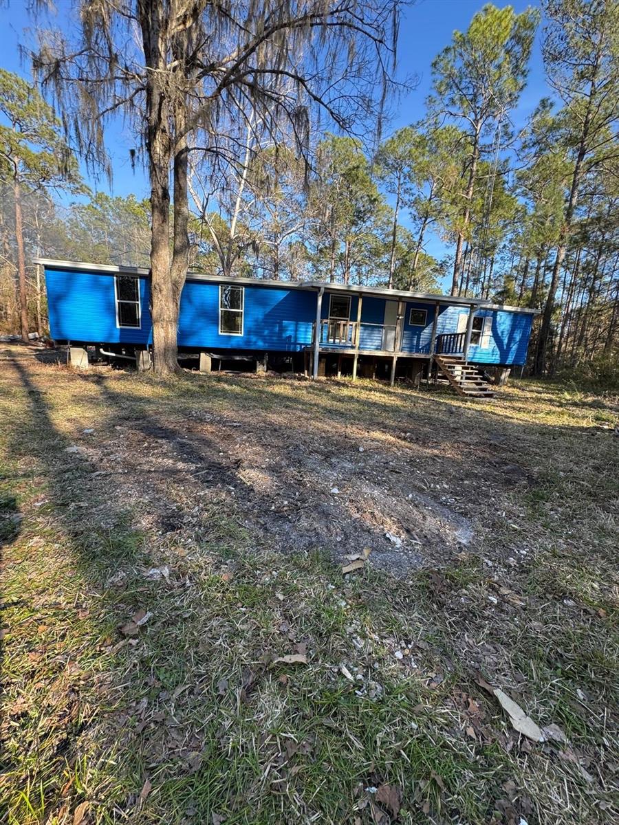 Opportunity awaits in peaceful Citra, FL in beautiful Marion County!

Situated on over an acre of land, this property offers the perfect setting for those craving space, privacy, and the freedom of country living. The mobile home has already had the exterior walls installed, providing a solid start to your vision, while the interior remains ready for completion—allowing you to design and finish the home exactly the way you want. Even better, the current owners have left the materials on-site, giving you a head start on bringing this project to life.

Equipped with well water and a septic system, this property offers rural convenience without HOA restrictions—ideal for outdoor enthusiasts, hobby farmers, or anyone looking for room to roam.

Nature lovers will appreciate the location, surrounded by nearby stables, campgrounds, and riding trails, and just minutes from Indian Lake State Forest Campground. Enjoy easy access to outdoor adventures at Salt Springs, and the convenience of being a short drive to Ocala and Fort McCoy.

Whether you're looking for an investment opportunity, a weekend retreat, or the chance to create your own country escape, this property offers endless potential in a serene North Central Florida setting.