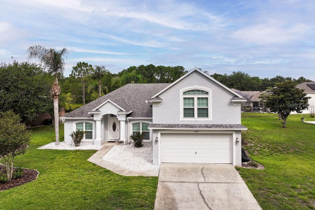 Welcome to this beautifully maintained 5-bedroom, 3-bathroom pool home located in the gated community of Grand Reserve in Davenport. This home is perfect for multigenerational living with two primary suites. With conservation views in the front, no rear neighbors, and a private pool and spa, this home offers the space, privacy, and flexibility that so many buyers are looking for.
As you enter the home, you'll find a formal dining room on one side and a flex space on the other that can easily serve as a home office, sitting room, playroom, or whatever best fits your lifestyle. The spacious eat-in kitchen offers plenty of cabinet and counter space and opens to the family room, creating a comfortable gathering space for everyday living and entertaining.
One of the features that makes this home truly special is the dual primary suite floor plan. With a primary suite on both the first and second floors, the layout is ideal for multigenerational living, visiting guests, or anyone who appreciates a little extra privacy. Three additional bedrooms and a third full bath provide plenty of room for family and friends.
Step outside and enjoy your own private Florida retreat. The screened lanai features a sparkling pool and spa surrounded by mature hedges, creating a peaceful setting for morning coffee, weekend barbecues, or relaxing after a long day.
The major updates have already been taken care of, including a new HVAC system (2025), pool heater (2025), reverse osmosis system (2025), water softener (2024), stove (2026), windows and doors (2019), roof (2016), and gutters (2013).
Grand Reserve is known for its natural lakes, wetlands, and peaceful surroundings, yet you're just minutes from Champions Gate, shopping, dining, golf, I-4, Disney, and everything Central Florida has.
Whether you're looking for a primary residence, or a vacation home, this home offers the perfect combination of comfort, privacy, and location. Come see for yourself why so many love calling Grand Reserve home.