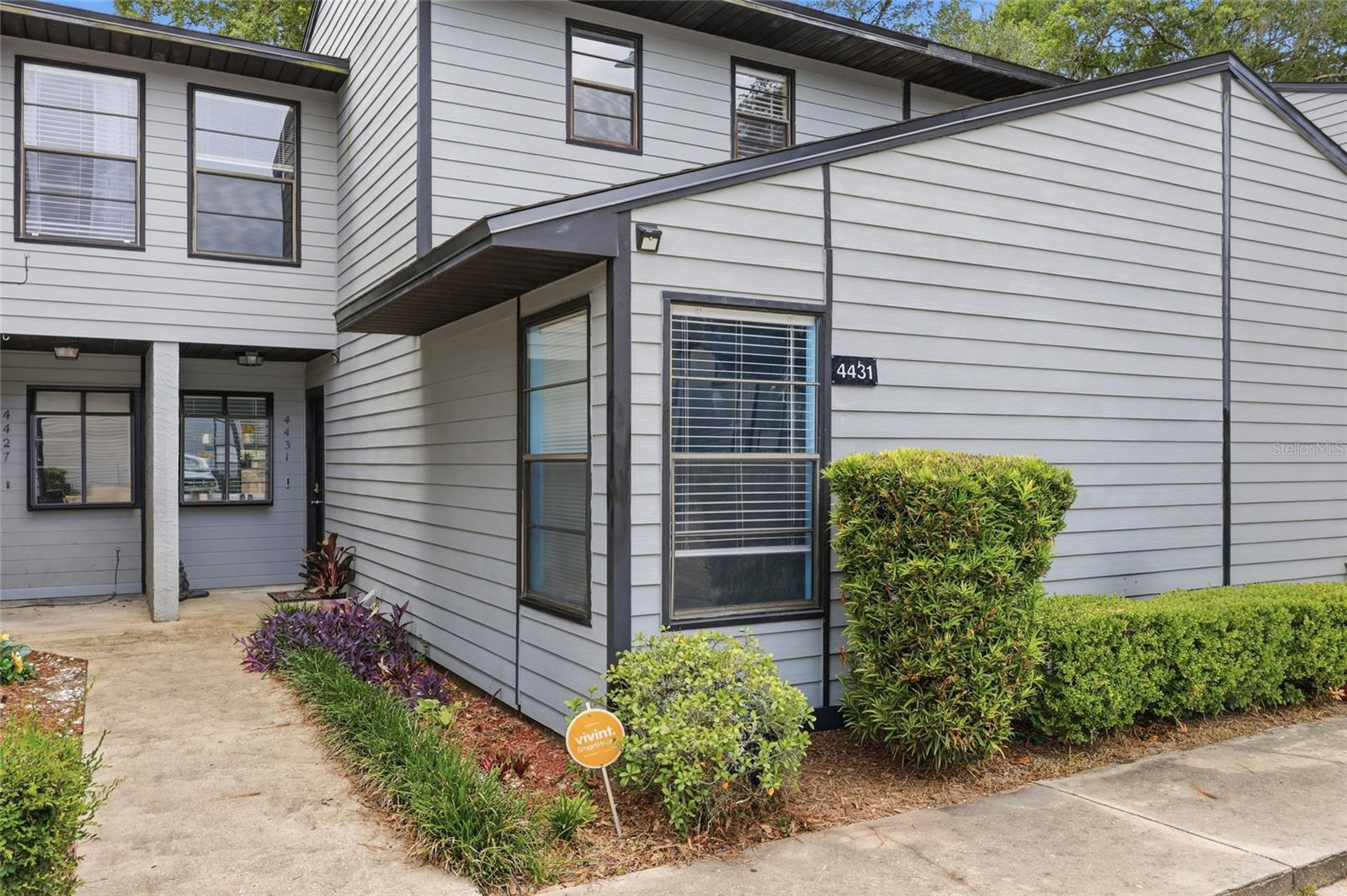 Located in the desirable Marchwood Community, this move-in-ready 2BR/2BA townhome offers an unbeatable location in the heart of Gainesville, just minutes from premier shopping, dining, entertainment, I-75, North Florida Regional Medical Center, UF Health Shands Hospital, and the University of Florida. The open floor plan features vaulted ceilings in the living and dining areas, a skylight over the staircase, and a kitchen that overlooks the main living space. The private second-floor primary suite includes a full bath and additional storage. Enjoy a fully fenced backyard with a deck, perfect for relaxing or entertaining. Recent updates include a new roof (2022), new light fixtures throughout, brand-new ceiling fans in both bedrooms, a fully fenced backyard (2026), and custom stairwell shelving (2026). Community amenities include a pool and low HOA fees. Two assigned parking spaces plus guest parking. This charming townhome is ready for its next owner!