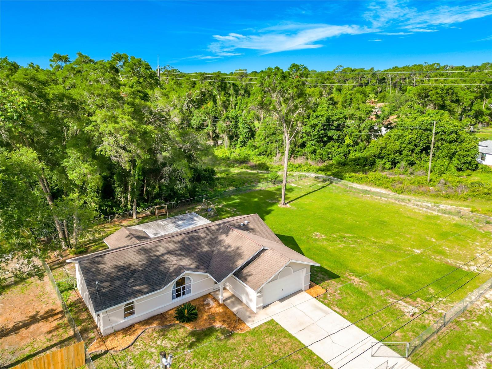 Now's your chance! If you've been looking for the perfect home in Inverness, minutes from downtown, but far enough out you've got a half-acre more or less. Look no further and stop the search. Here at 6110 E Wingate you'll find the perfect sized home that comes with the vacant, cleared and sodded, homesite next door. Both properties are fully fenced together as one. Inside you'll feel right at home, with everything being beautifully updated. Relax outback, under your huge screened and covered rear porch checking on the recent garden you planted or the kids playing on the playground. Plenty of room outside for all your toys or whatever outdoors and tons of parking. NO HOA, NO DEED RESTRICTIONS! Minutes from the State Forest, trails, entertainment, health care, boating, golfing, popular shopping and restaurants. A real must see! Schedule your personal tour today!
