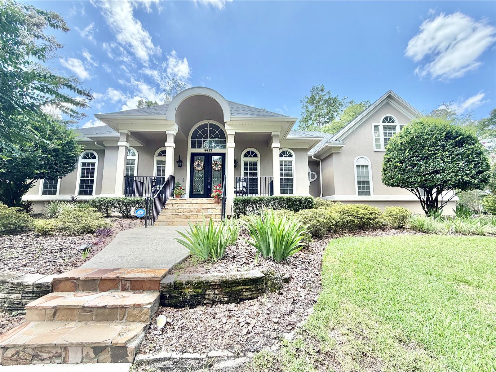Welcome to this stunning pool home featuring 5 bedrooms, 4 bathrooms, plus an office study and sitting room/formal dining room! Nestled on a prime .63-acre lot in Stratford Ridge @ Haile Plantation, the property boasts lush, private landscaping. Step into the inviting foyer, with a French-doored study/office to the left and a dining/sitting/flex room to the right. The spacious kitchen includes stainless steel appliances (brand new gas stove), an island, and overlooks the great room. Beautiful wood flooring, crown molding and detailed trim work flow through most of the home. The split floor plan ensures privacy for all the bedrooms. The master suite is tucked away with pool and backyard views, offering two walk-in closets with upgraded wood shelving and a luxurious bathroom with a separate tub, shower, and updated fixtures. A large bonus/ 5th bedroom room spans over the 3-car garage and includes its own bathroom and closet. Enjoy outdoor living with a heated pool, outdoor kitchen and dining space all covered by a screened lanai facing the spacious fenced yard. Recent updates include CAT 7 internet wiring and commercial-grade Wi-Fi extenders by Sound Ideas, making working or studying from home a breeze. Stratford Ridge is conveniently close walking trails, Publix Market Square, Chiles Elementary, Hawkstone Country Club, and the Haile Village Center for all kinds of options on shopping, dining, professional offices and Saturday's Farmers market. Recent pool equipment, recent AC with high-efficiency furnace, and roof replaced in 2023. More pictures coming soon.