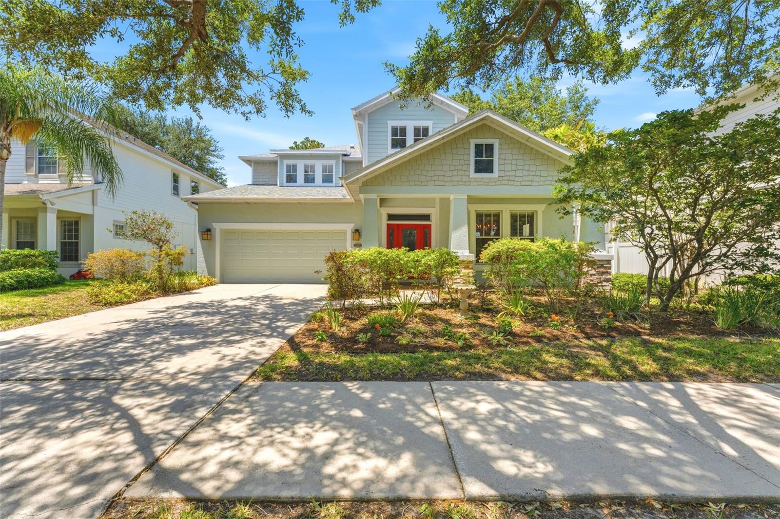 Tucked away on a dead-end street with no through traffic in Southgreen, one of South Tampa’s most charming hidden enclaves, this well-maintained five-bedroom, three-bath home offers the kind of neighborhood feel buyers are always hoping to find. With only 31 homes, private roads, sidewalks, mature oaks, a community greenspace, and a setting fenced on three sides, Southgreen has a quaint, old-school feel with peaceful streets, a connected community setting, and a sense of privacy that is hard to replicate.

The front porch overlooks the neighborhood greenspace, creating the perfect spot for morning coffee, evening conversations, or simply enjoying the peaceful setting. Inside, the home is warm, spacious, and thoughtfully designed for everyday living. Wood floors, generous natural light, and a flexible layout create an easy flow from the front of the home to the main living areas.

At the front of the home, a formal dining room or sitting area offers a beautiful flex space for hosting, working, or creating a quiet lounge. The kitchen opens to the living room and eat-in dining area, making it easy to stay connected whether you are cooking dinner, entertaining, or keeping an eye on the backyard. The kitchen features granite countertops, a glass backsplash with LED lighting, stainless steel GE Café appliances, a double oven, a large farmhouse sink, and a premium faucet.

The first floor includes a large bedroom that can live beautifully as a guest room, office, playroom, or flexible living space, with a full bath nearby and access toward the patio and screened lanai. Outside, the home is made for Florida living with a screened lanai and a screened saltwater pool featuring a seating bench, pool lighting, and a custom pool cage with opaque privacy screens for added comfort.

Upstairs, a built-in tech area with cabinetry creates a smart landing space for work, study, or household organization. The spacious primary suite includes a seating area, a renovated bathroom, and two walk-in closets with built-in closet systems. The secondary bedrooms are nicely sized, with walnut solid hardwood flooring, built-in closet systems throughout, and a second-floor laundry room for everyday convenience.

Additional highlights include built-in garage cabinetry, interior and exterior repainting with premium Benjamin Moore paint, a 2025 shingle roof, 2022 HVAC system for both units, 2024 water heater, 2024 salt chlorinator and pool pump, and washer and dryer that convey.

The location adds even more to the lifestyle. Southgreen feels quiet and tucked away, yet it is close to Bayshore Boulevard, MacDill 48 Park, Gadsden Park, Ballast Point Park, Tampa Yacht & Country Club, SOG Café, and the new Mad Dogs & Englishmen. Nearby Interbay Commons is also planned to bring a mixed-use destination to the area with townhomes, retail space, a Goddard School, F45, and additional retailers. With quick access to major routes heading west toward the beaches and east toward Brandon, this location makes it easy to enjoy South Tampa living while staying connected across the bay area.

Quiet, connected, and hard to replicate, this home offers a rare combination of space, privacy, updates, and true neighborhood feel in South Tampa.